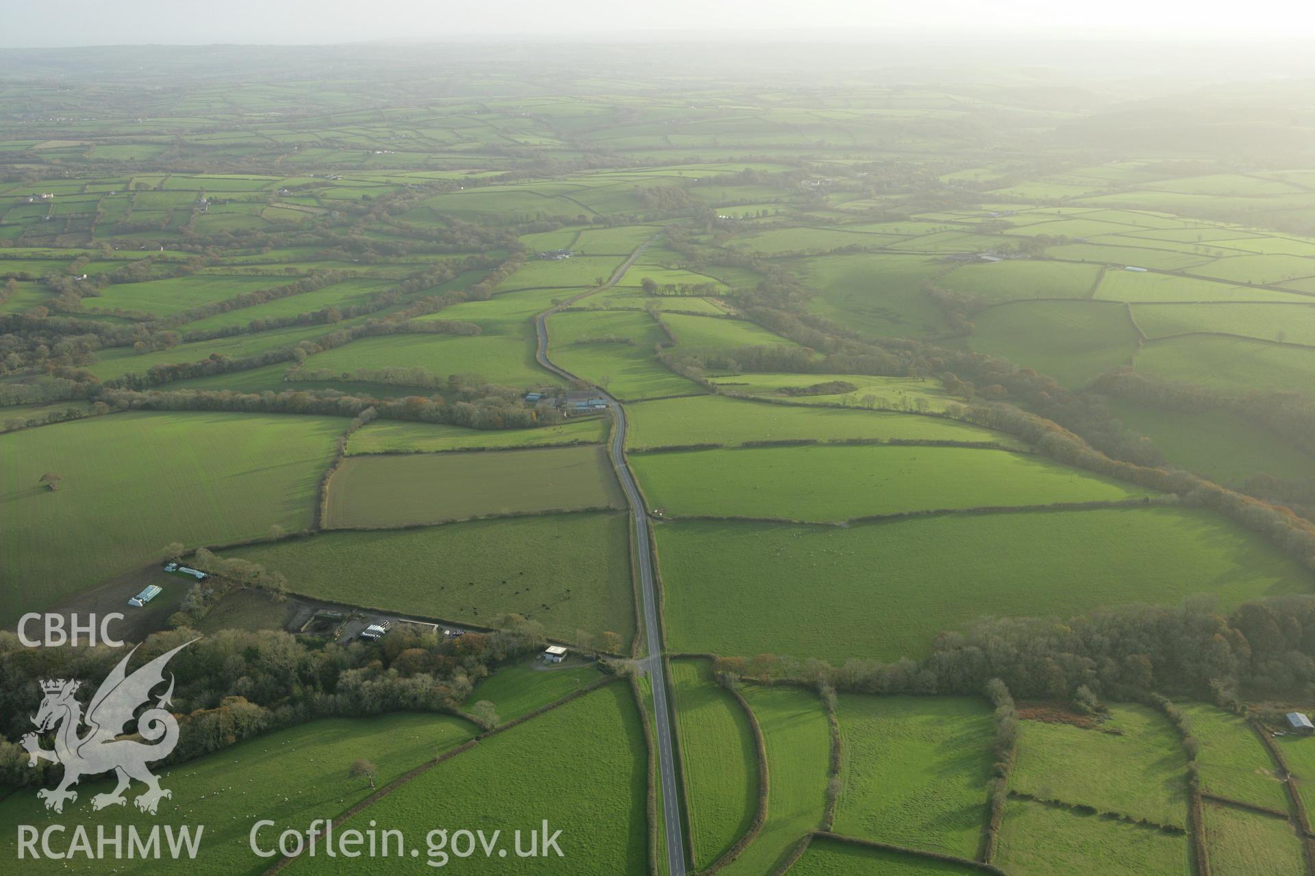 RCAHMW colour oblique photograph of Brechfa;concentric cropmark enclosure North-West of. Taken by Toby Driver on 06/11/2007.