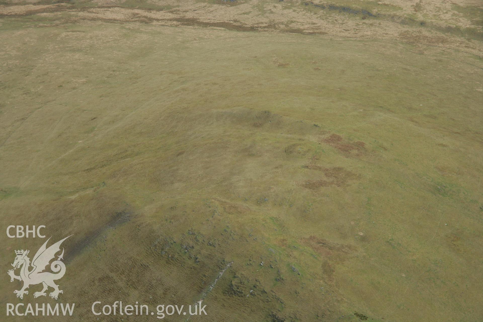 RCAHMW colour oblique aerial photograph of Disgwylfa Fawr Cairn. Taken on 17 April 2007 by Toby Driver