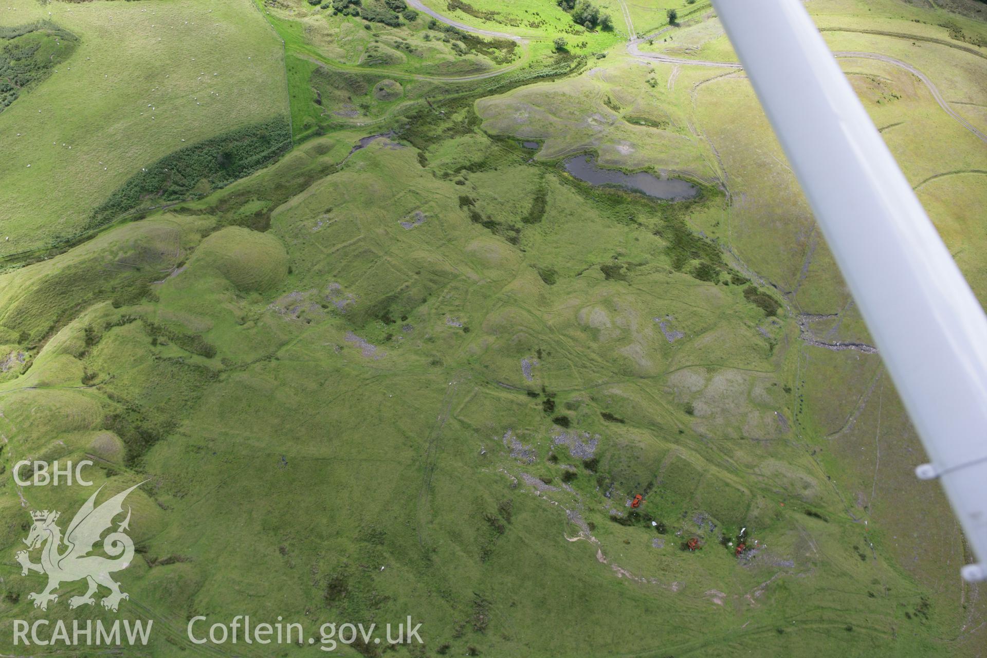 RCAHMW colour oblique aerial photograph of the deserted Ffos y Fran Ironstone Workers Settlement. Taken on 30 July 2007 by Toby Driver