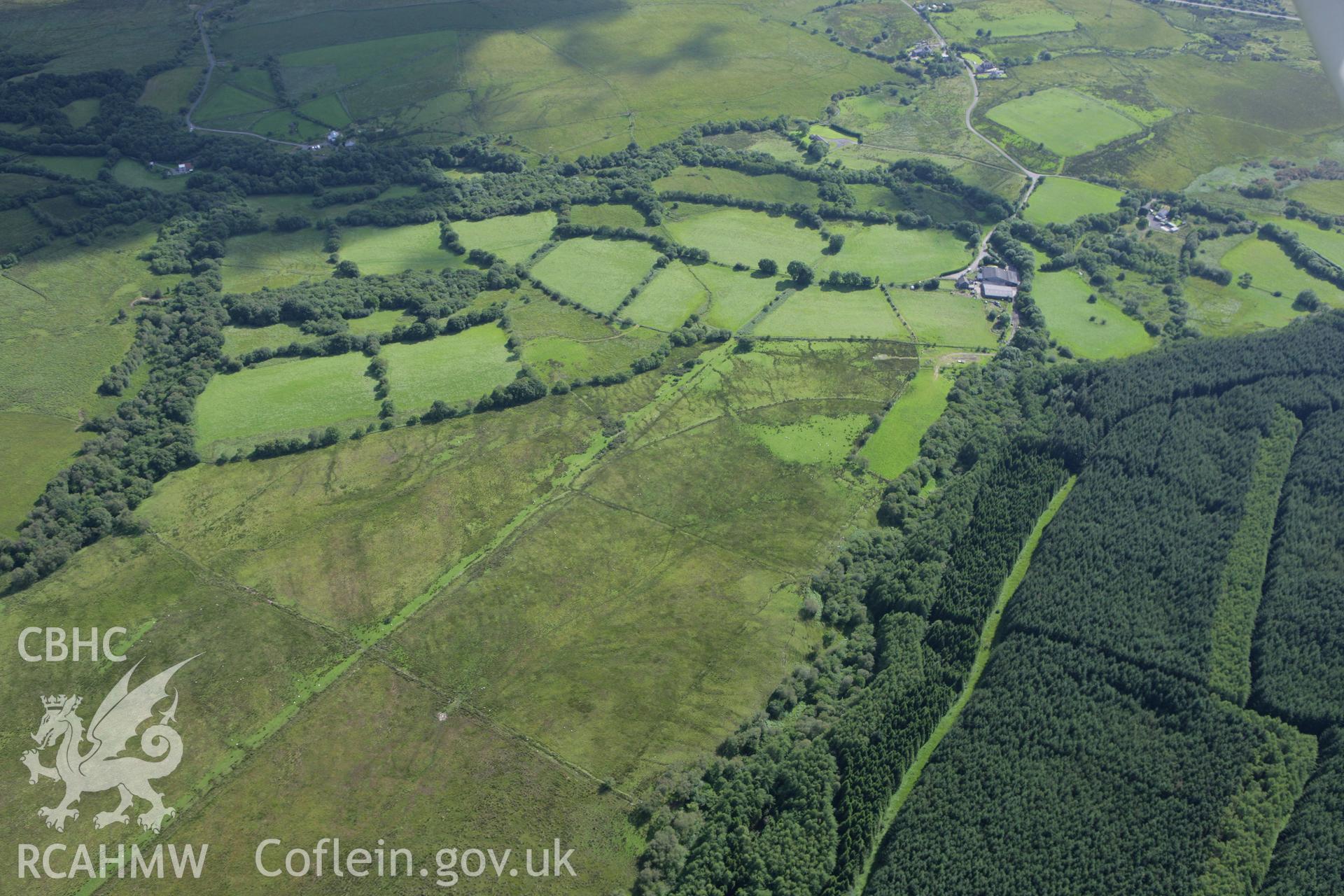 RCAHMW colour oblique aerial photograph of a section of Sarn Helen Roman Road northeast of Coelbren Fort. Taken on 30 July 2007 by Toby Driver