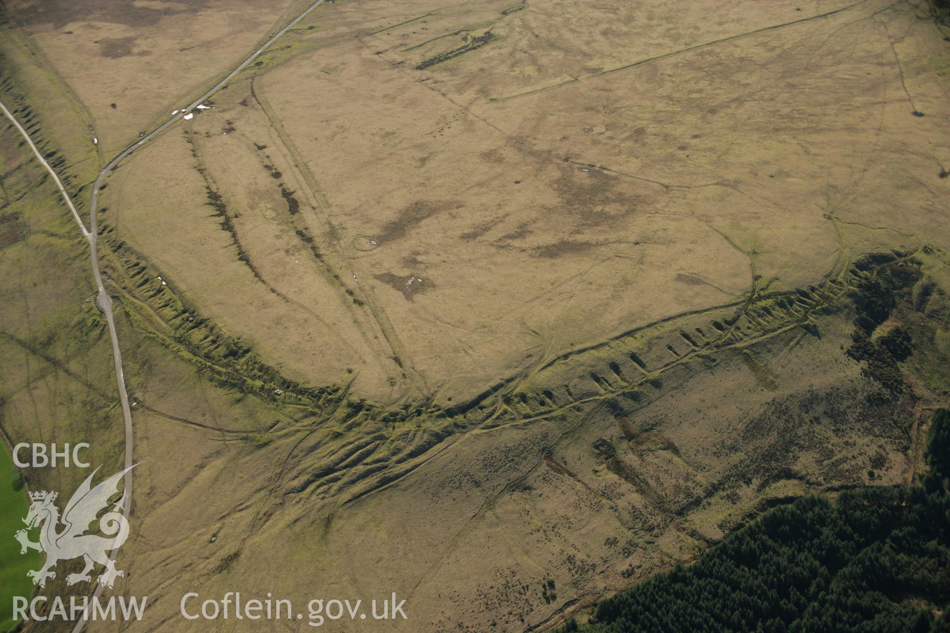 RCAHMW colour oblique aerial photograph of a ring cairn on Tor Clawdd. Taken on 21 March 2007 by Toby Driver