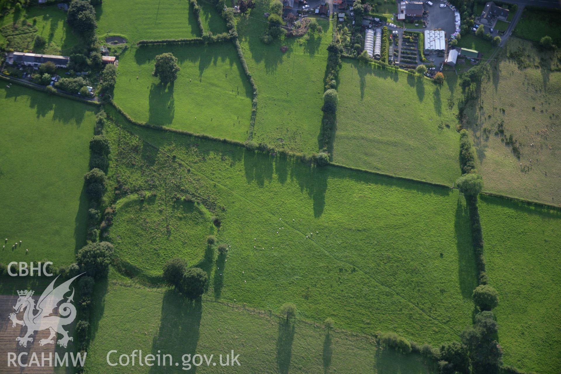 RCAHMW colour oblique aerial photograph of Caer Du Defended Enclosure. Taken on 08 August 2007 by Toby Driver