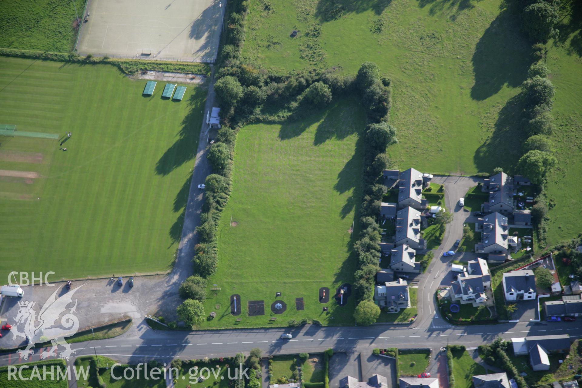 RCAHMW colour oblique aerial photograph of site of King George's Field Enclosure at Efailnewydd. Taken on 06 September 2007 by Toby Driver