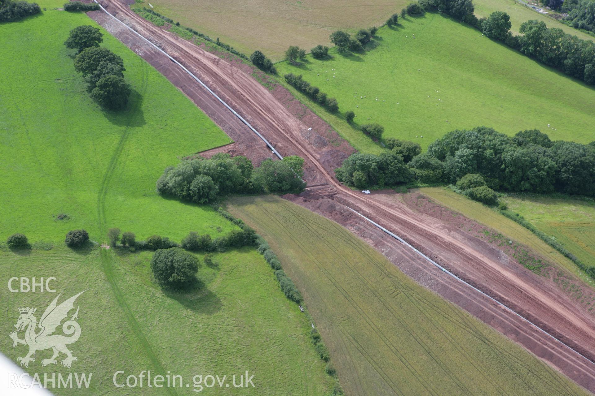 RCAHMW colour oblique aerial photograph of Pipton Chambered Long Cairn. Taken on 09 July 2007 by Toby Driver