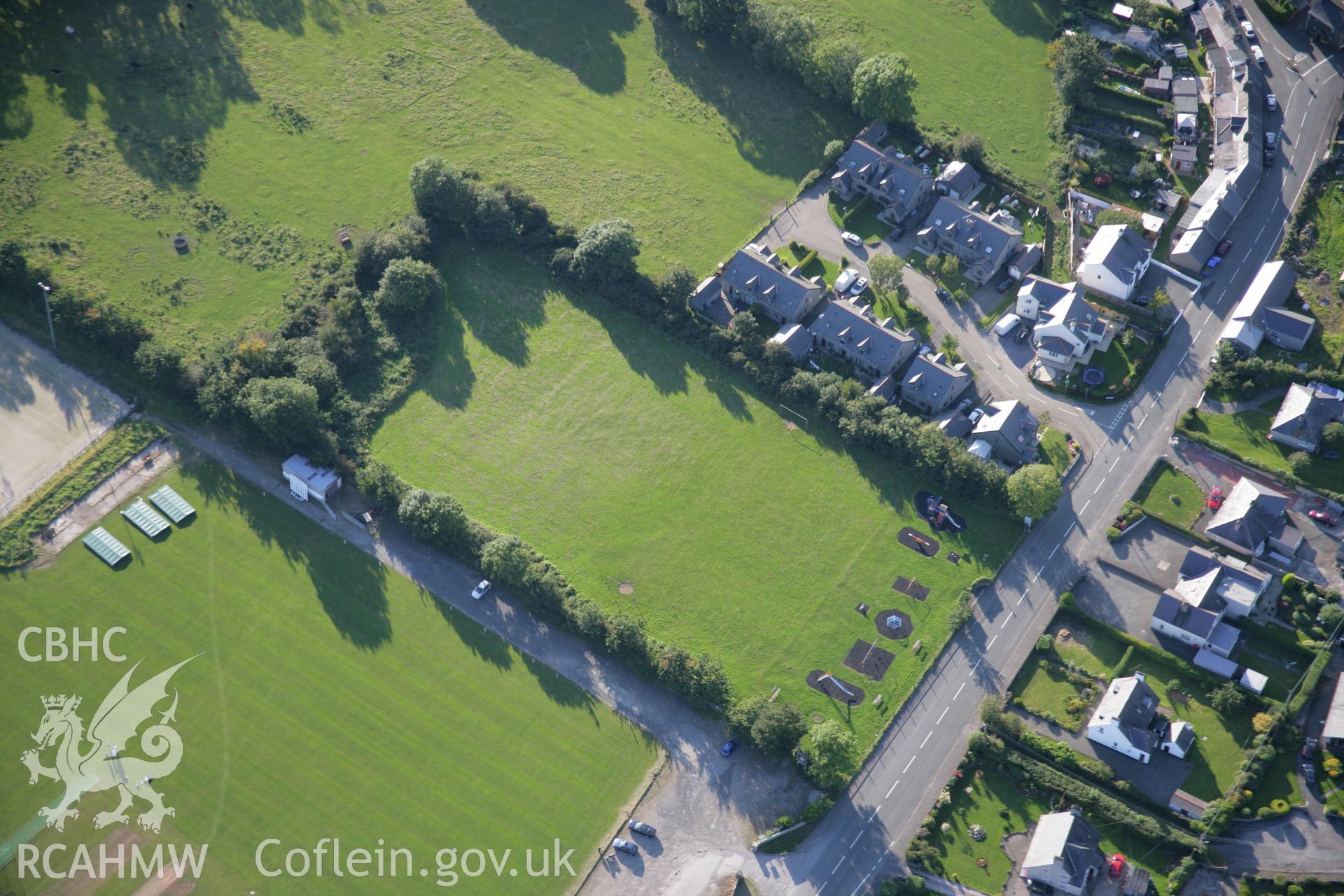 RCAHMW colour oblique aerial photograph of site of King George's Field Enclosure at Efailnewydd. Taken on 06 September 2007 by Toby Driver