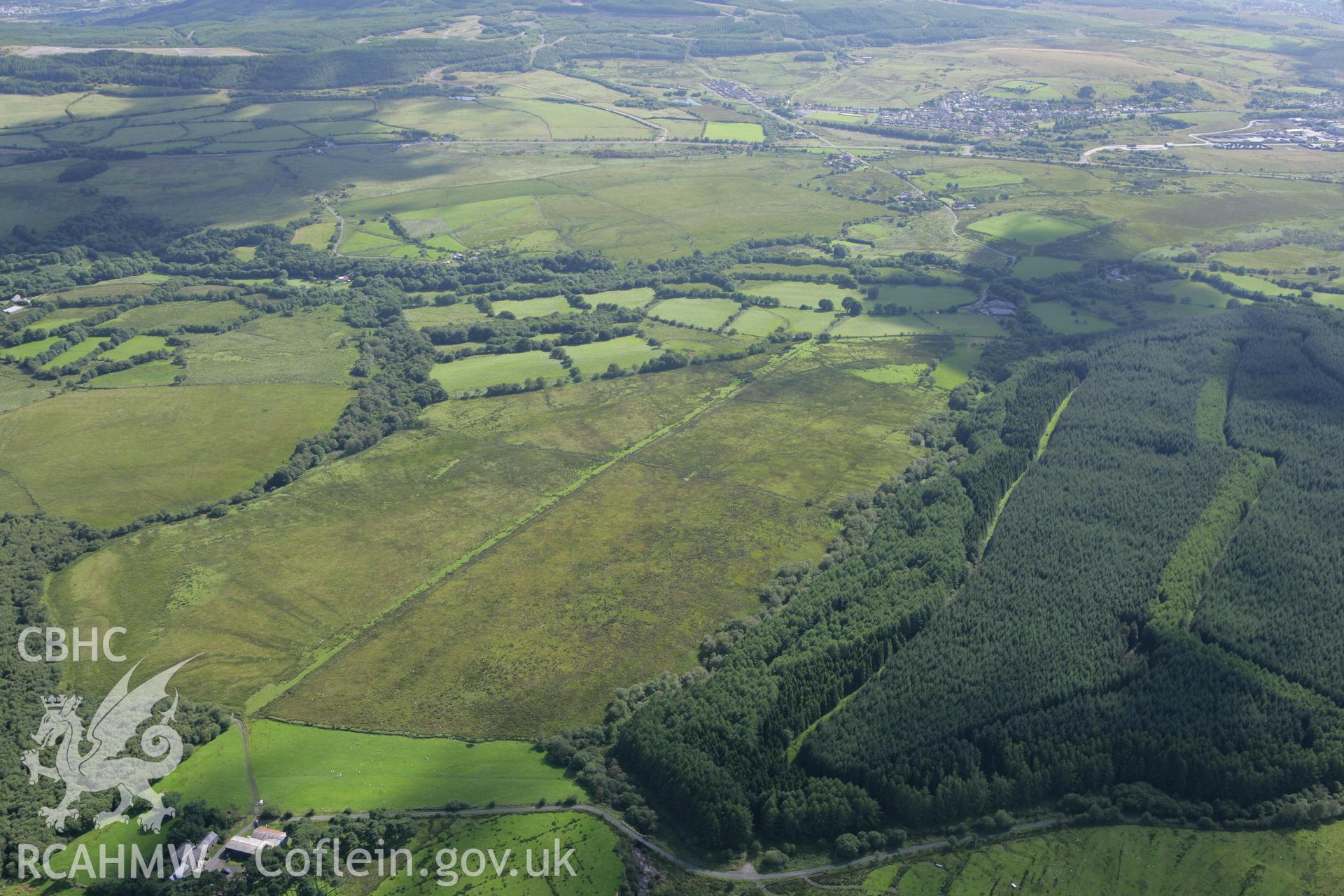 RCAHMW colour oblique aerial photograph of a section of Sarn Helen Roman Road northeast of Coelbren Fort. Taken on 30 July 2007 by Toby Driver