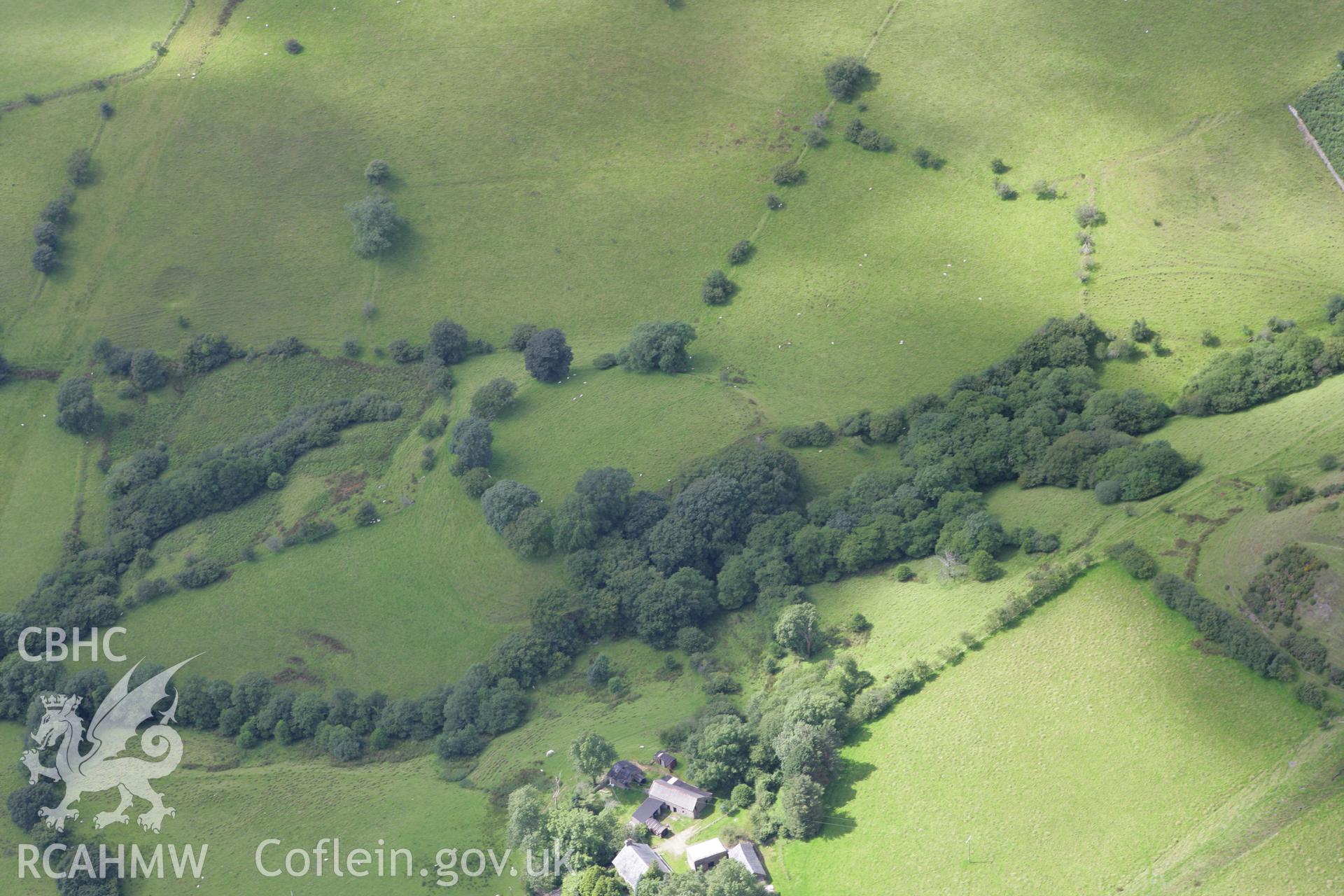 RCAHMW colour oblique aerial photograph of Ty'n-y-Waun Enclosure Cwm Llwyd. Taken on 30 July 2007 by Toby Driver