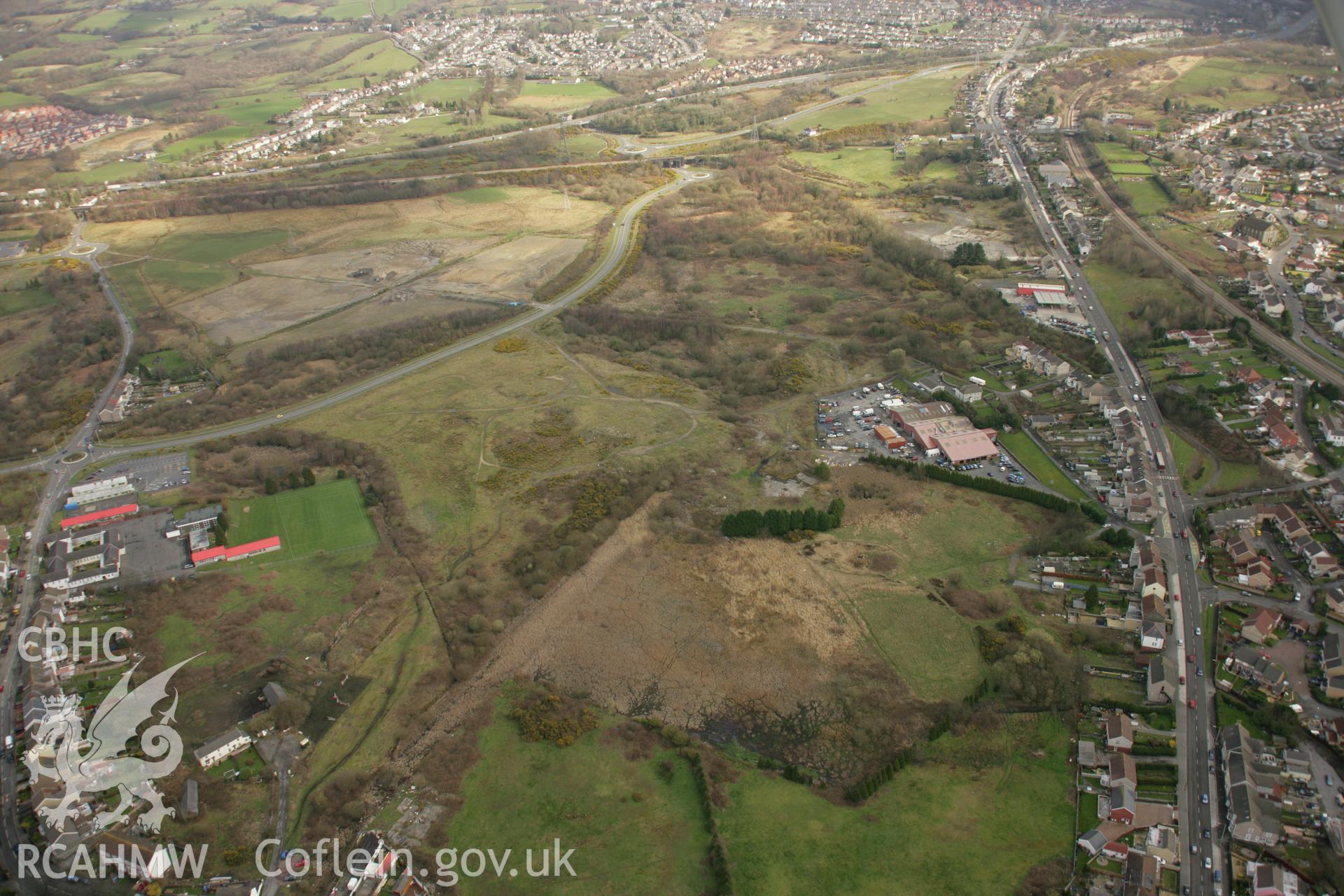 RCAHMW colour oblique aerial photograph of St Samlet's Church, Llansamlet, with the former line of the canal visible. Taken on 16 March 2007 by Toby Driver