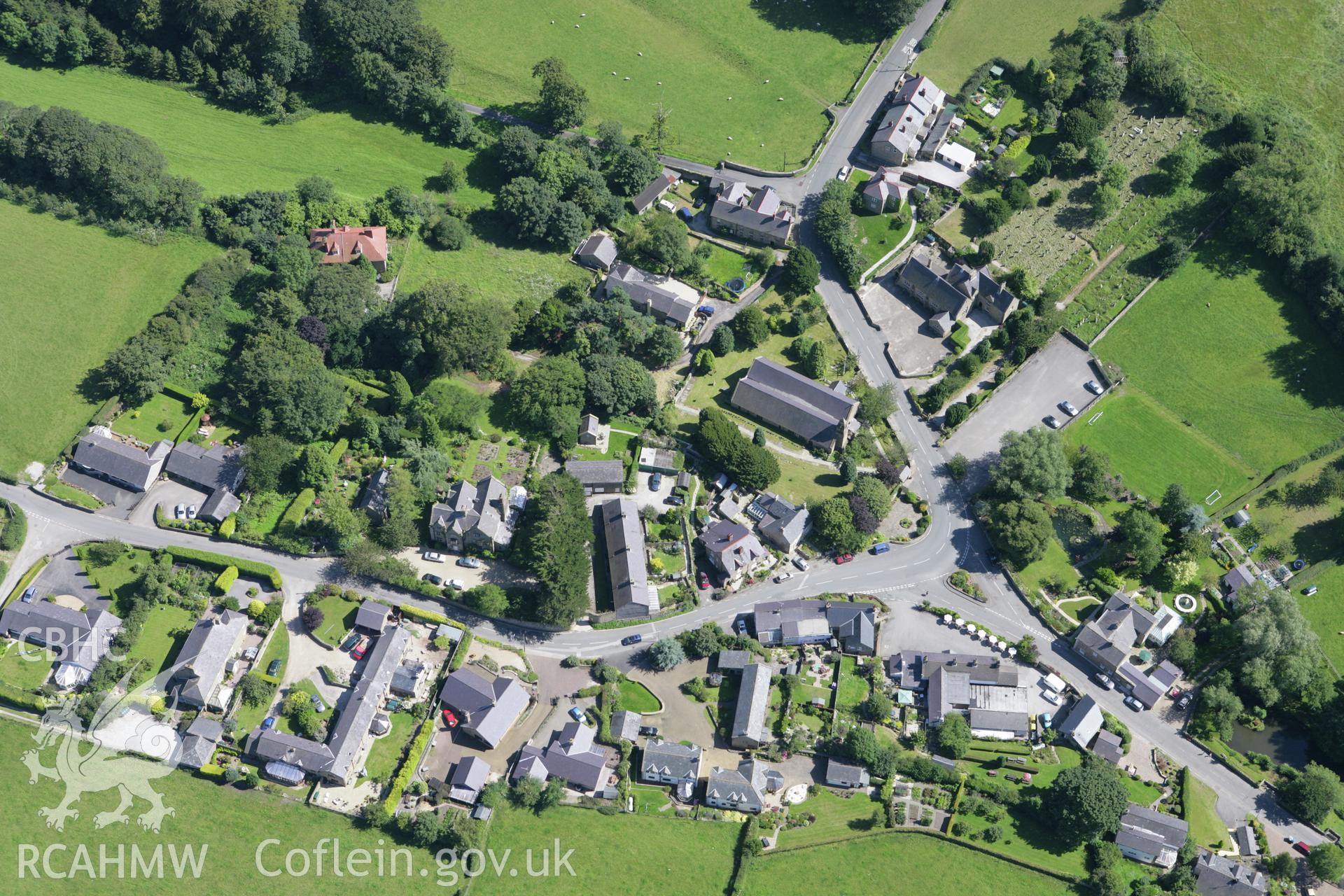 RCAHMW colour oblique aerial photograph of Church of St Asaph and Cyndeyrn, Llanasa Village. Taken on 31 July 2007 by Toby Driver