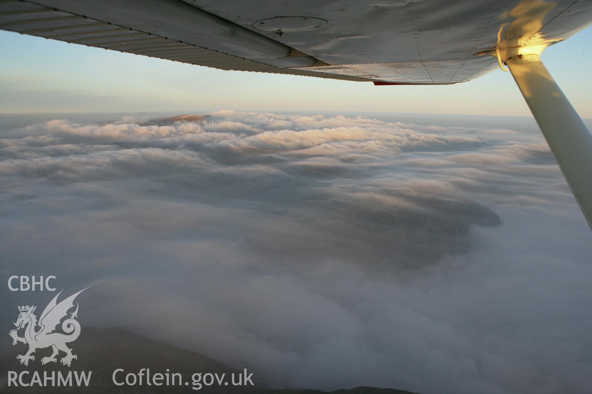 RCAHMW colour oblique photograph of Berwyn summit from the south, with cloud, in winter sunset. Taken by Toby Driver on 20/12/2007.