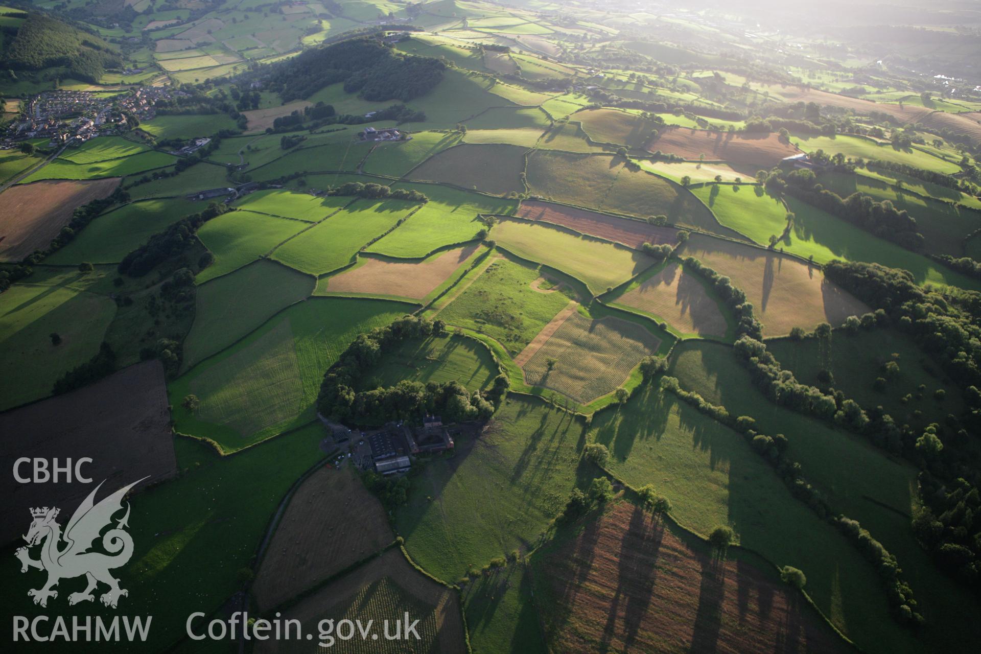 RCAHMW colour oblique aerial photograph of Great Cloddiau Enclosure. Taken on 08 August 2007 by Toby Driver