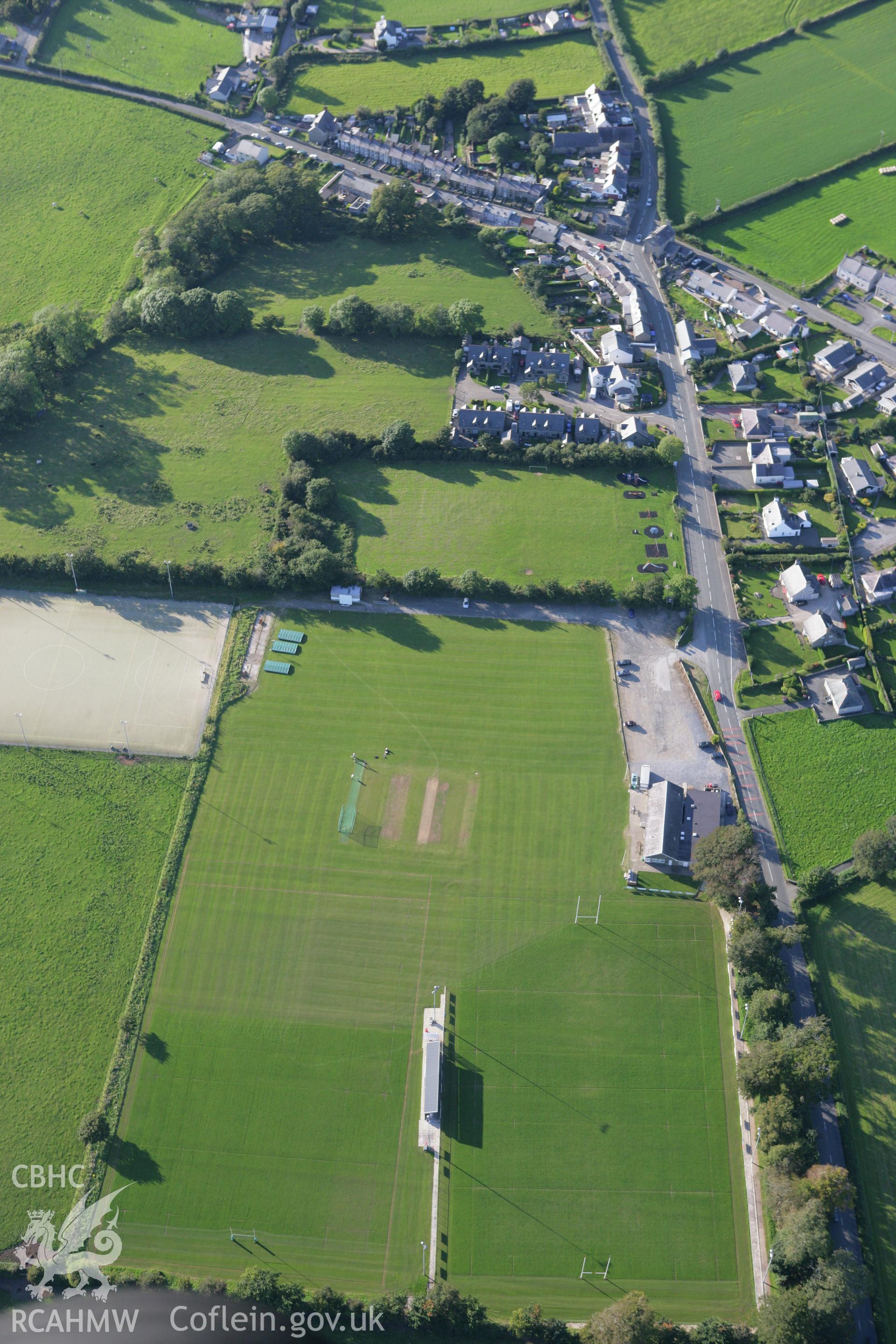 RCAHMW colour oblique aerial photograph of King George's Field Enclosure at Efailnewydd. Taken on 06 September 2007 by Toby Driver