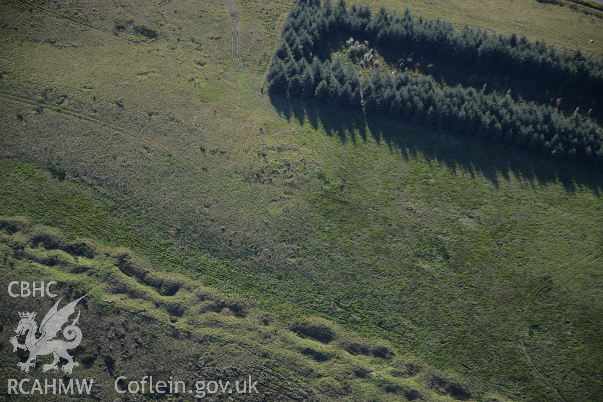 RCAHMW colour oblique aerial photograph of Garn Wen Round Cairn, Dixie's Corner, Llandeilo'r Fan. Taken on 08 August 2007 by Toby Driver