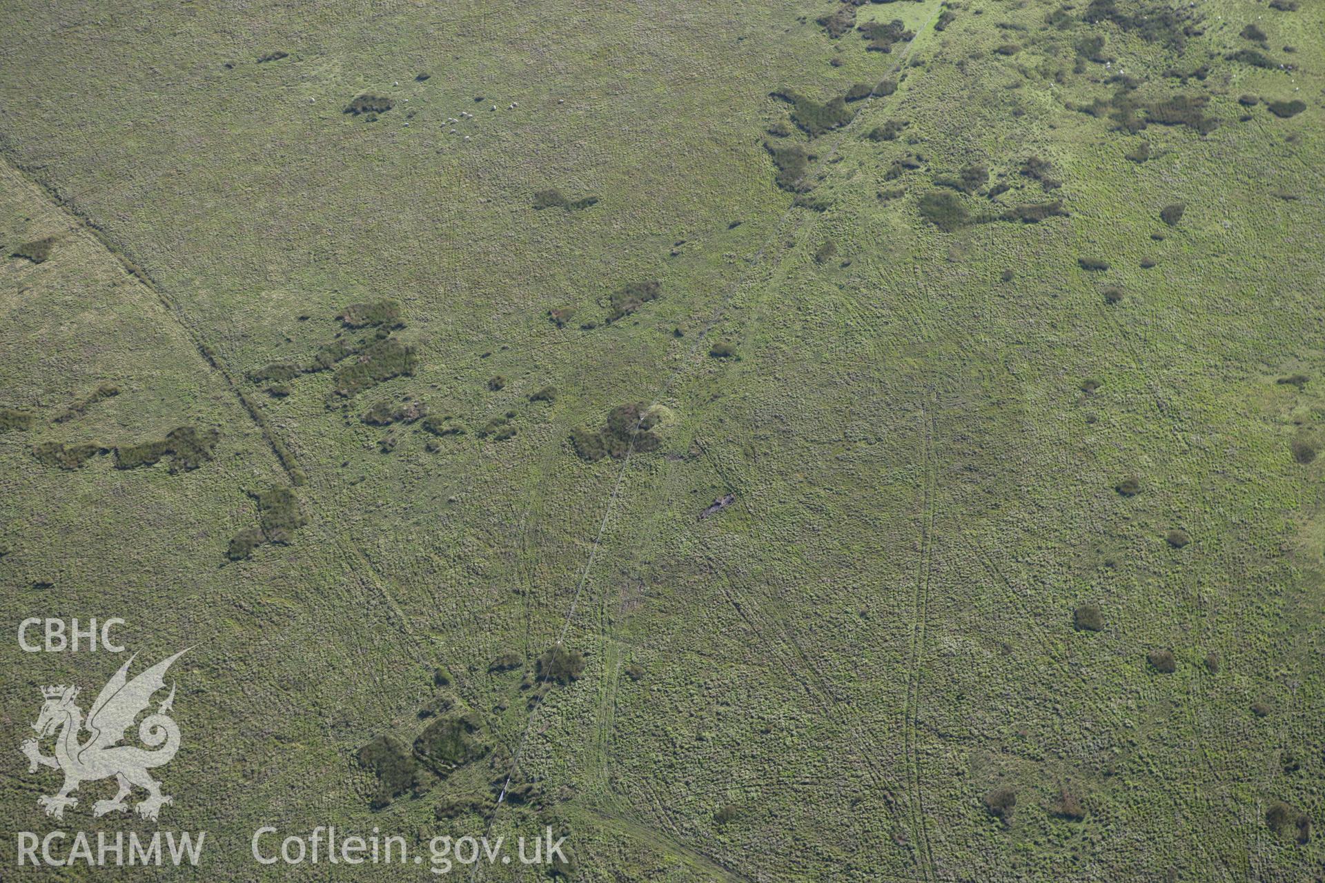 RCAHMW colour oblique aerial photograph of Crug Barrow, Llanfihangel Nant Bran. Taken on 08 August 2007 by Toby Driver