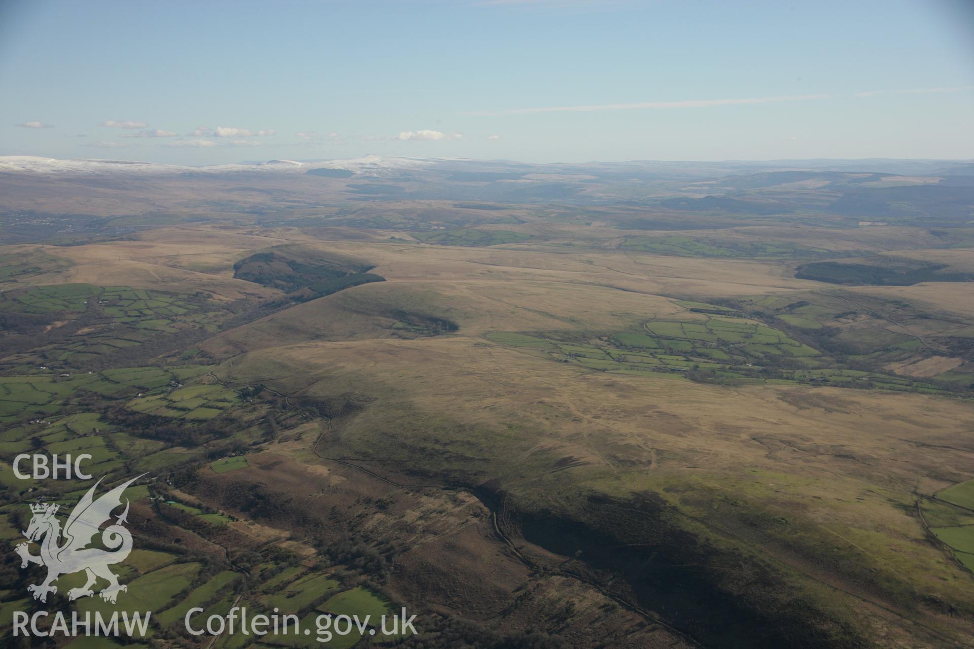 RCAHMW colour oblique aerial photograph of Graig Fawr (West) Enclosure in landscape view.. Taken on 21 March 2007 by Toby Driver