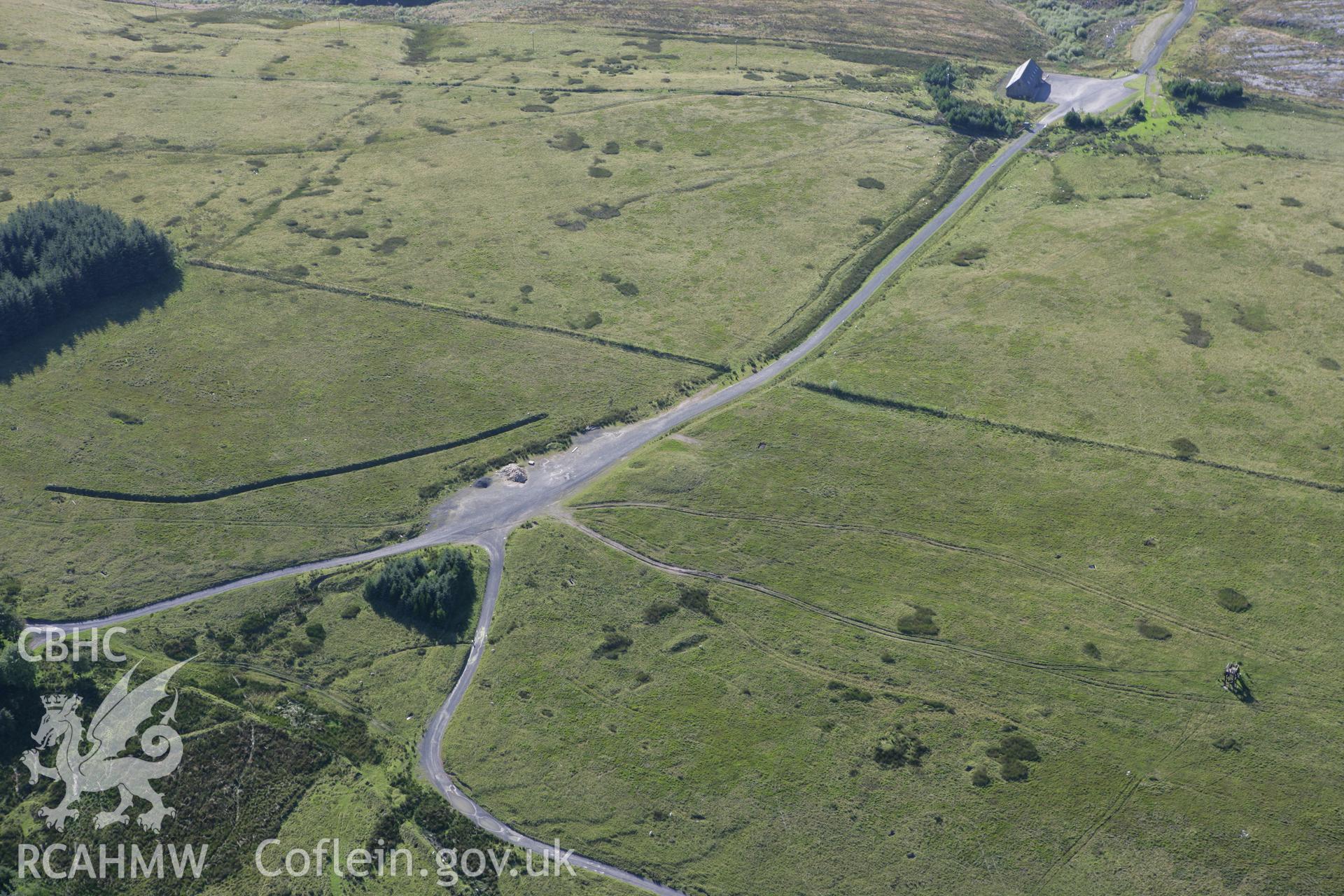 RCAHMW colour oblique aerial photograph of Ffynnon Dafydd Befan Cairn I. Taken on 08 August 2007 by Toby Driver