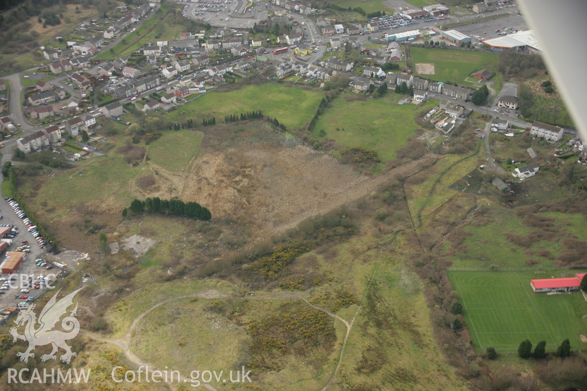 RCAHMW colour oblique aerial photograph of St Samlet's Church, Llansamlet, with the former line of the canal visible. Taken on 16 March 2007 by Toby Driver