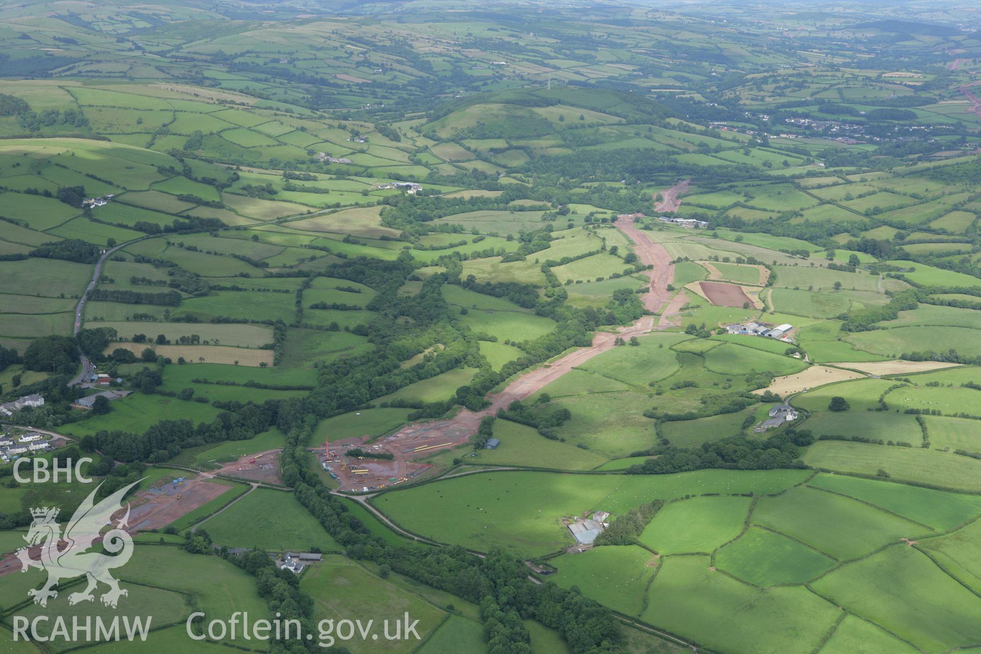 RCAHMW colour oblique aerial photograph of Trecastle with the LNG pipeline passing to the south. Taken on 09 July 2007 by Toby Driver