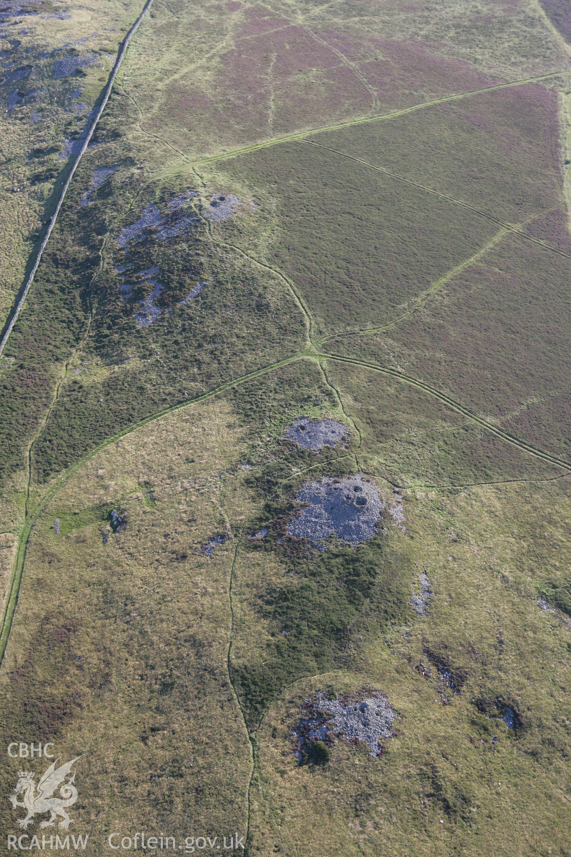 RCAHMW colour oblique aerial photograph of Mynydd Rhiw Cairn I. Taken on 06 September 2007 by Toby Driver