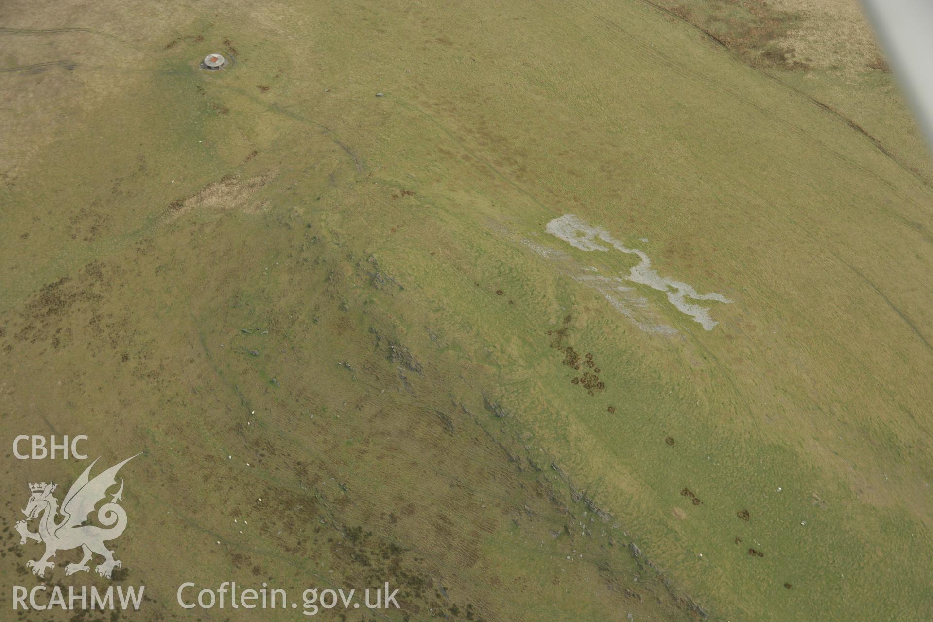 RCAHMW colour oblique aerial photograph of Dinas Hillfort. Taken on 17 April 2007 by Toby Driver