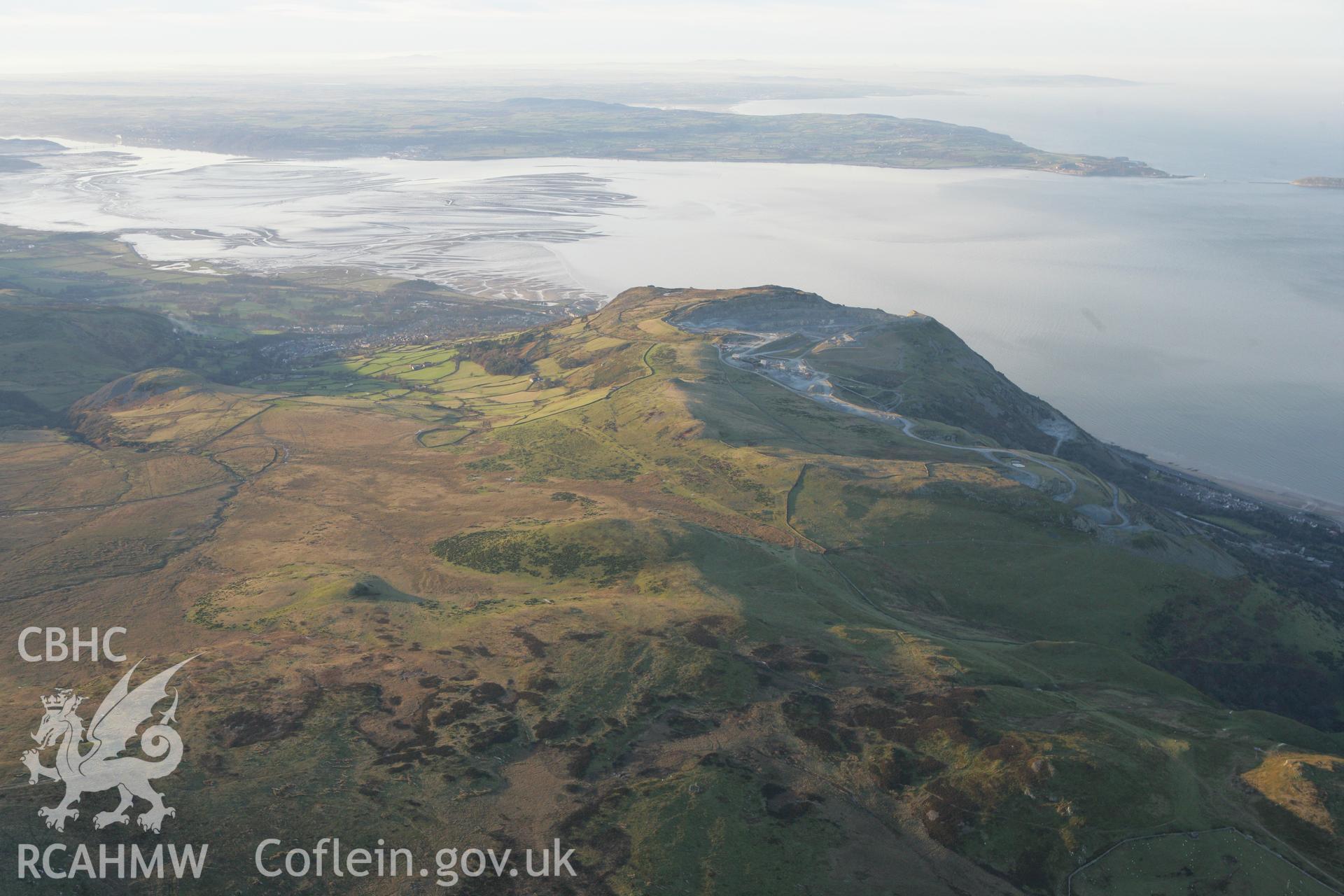 RCAHMW colour oblique photograph of Penmaenmawr, showing a winter landscape over Braich y Dinas. Taken by Toby Driver on 20/12/2007.