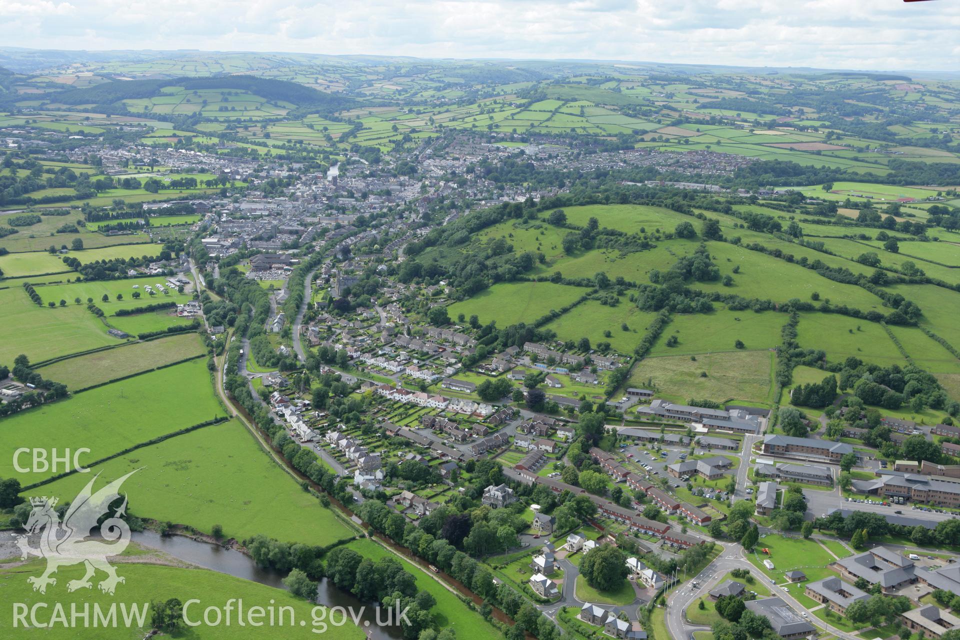 RCAHMW colour oblique aerial photograph of Slwch Camp, also showing Brecon. Taken on 09 July 2007 by Toby Driver