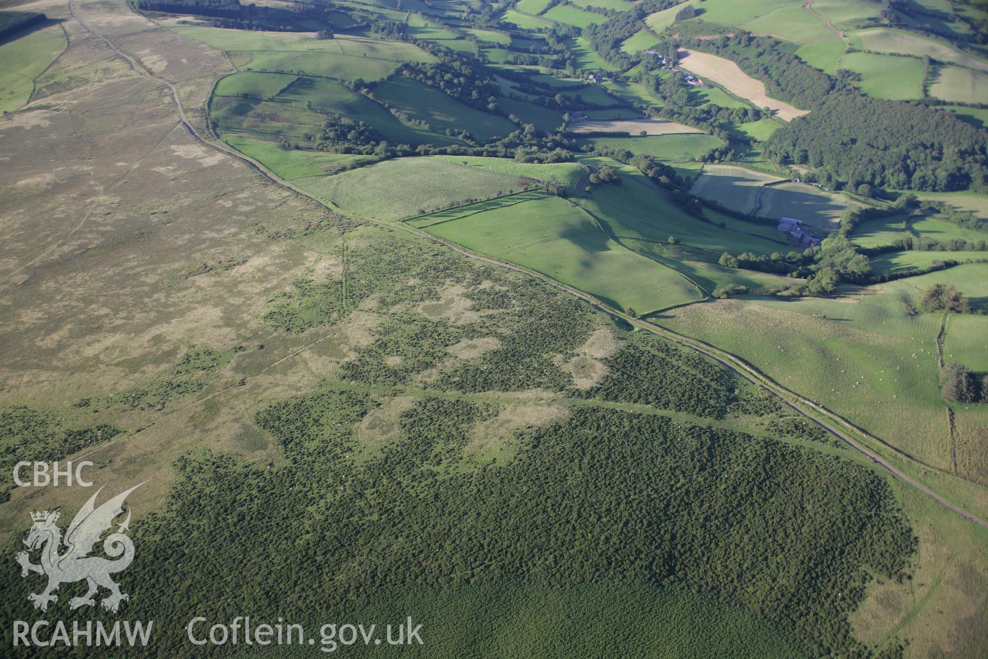 RCAHMW colour oblique aerial photograph of Gwar-y-Felin Cairn. Taken on 08 August 2007 by Toby Driver