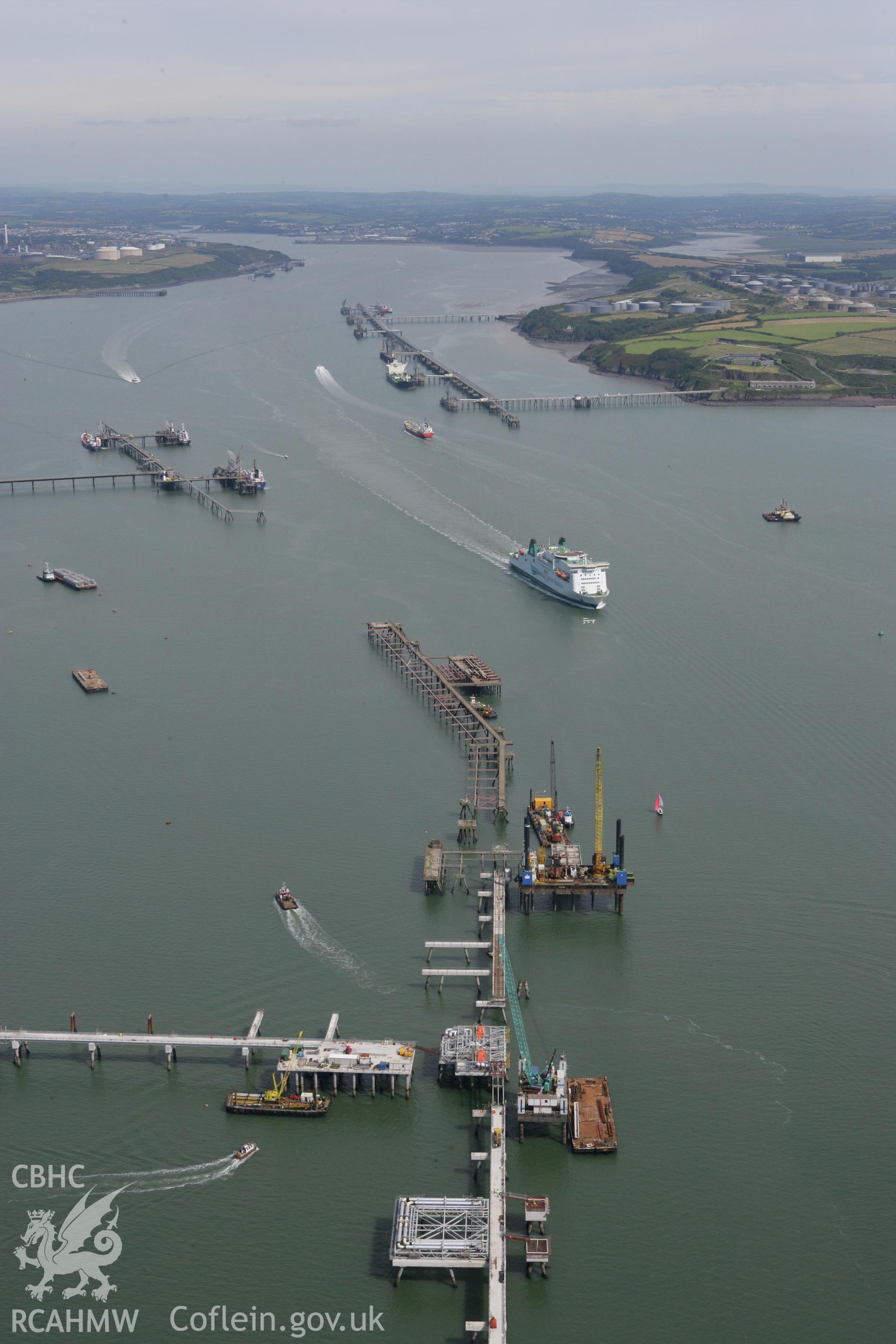 RCAHMW colour oblique photograph of Milford Haven Waterway, with ferry departing. Taken by Toby Driver on 01/08/2007.