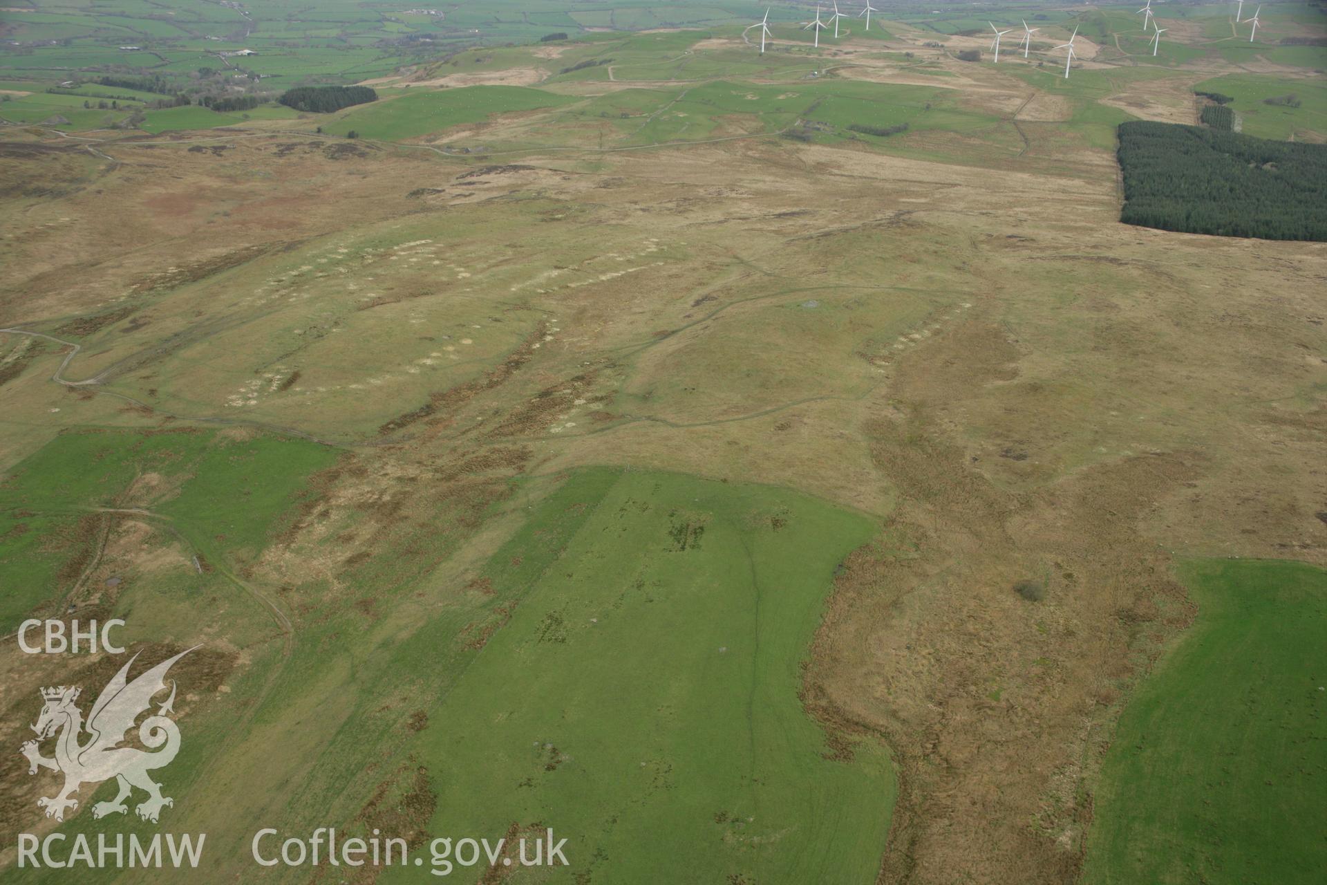 RCAHMW colour oblique aerial photograph of Tan-yr-Esgair Cairn I. Taken on 17 April 2007 by Toby Driver