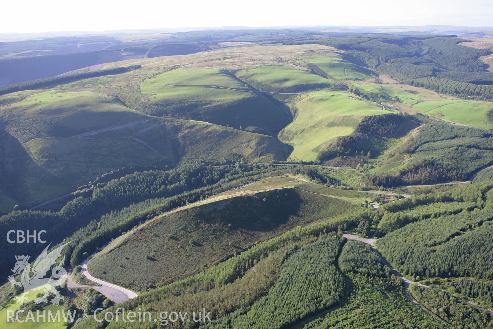 RCAHMW colour oblique aerial photograph of Sugar Loaf Hillfort. Taken on 08 August 2007 by Toby Driver