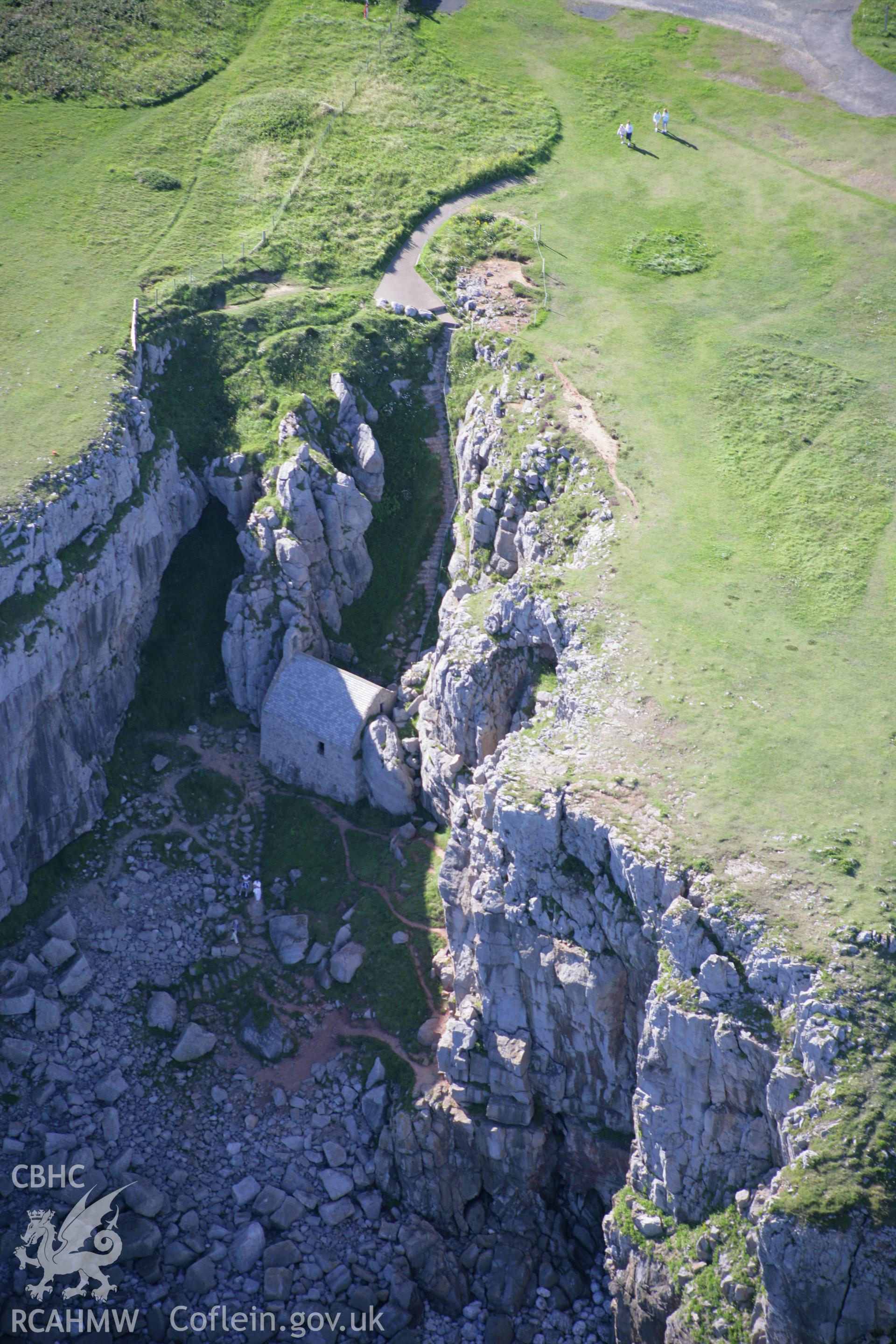 RCAHMW colour oblique aerial photograph of St Govan's Chapel. Taken on 30 July 2007 by Toby Driver