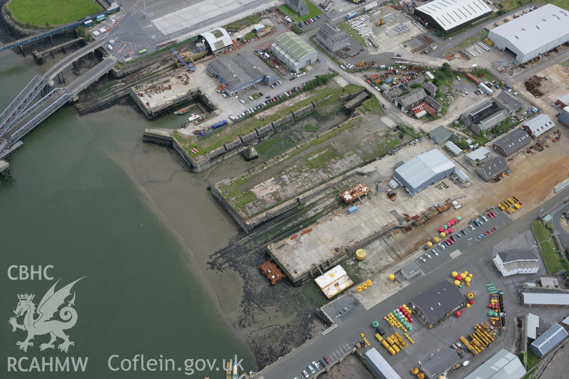 RCAHMW colour oblique photograph of Pembroke Dockyard, Dry Dock. Taken by Toby Driver on 01/08/2007.