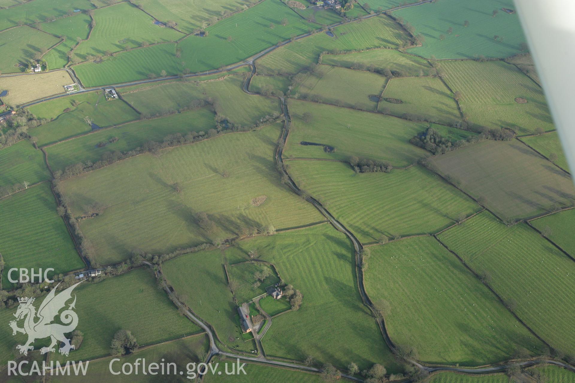 RCAHMW colour oblique photograph of Peartree Farmhouse;Peartree Farmhouse field systems. Taken by Toby Driver on 11/12/2007.