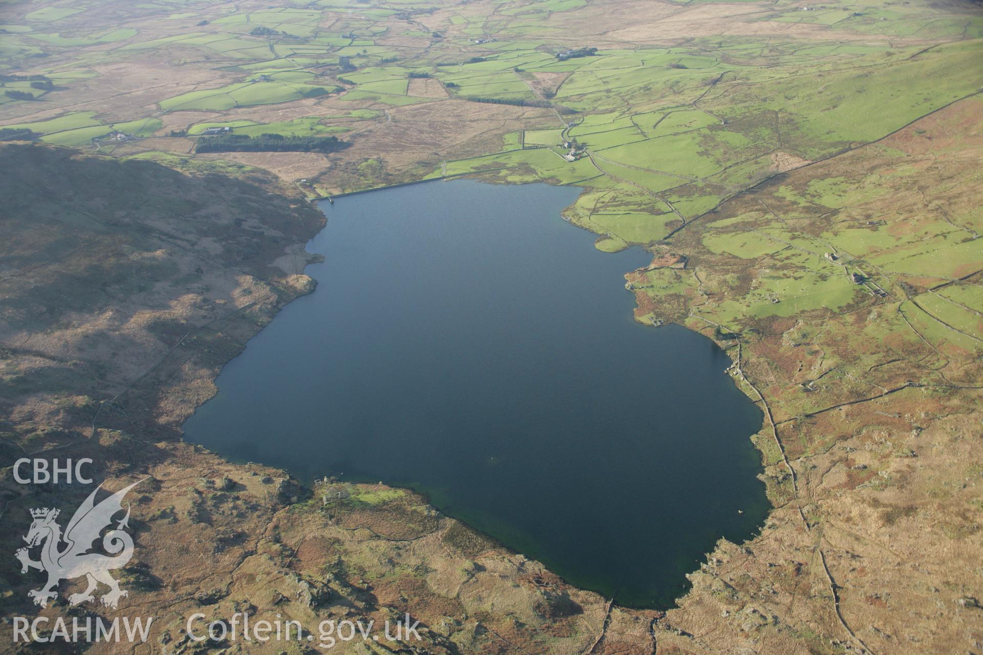 RCAHMW colour oblique aerial photograph showing landscape view of Llyn Cwmystradllyn Reservoir. Taken on 25 January 2007 by Toby Driver