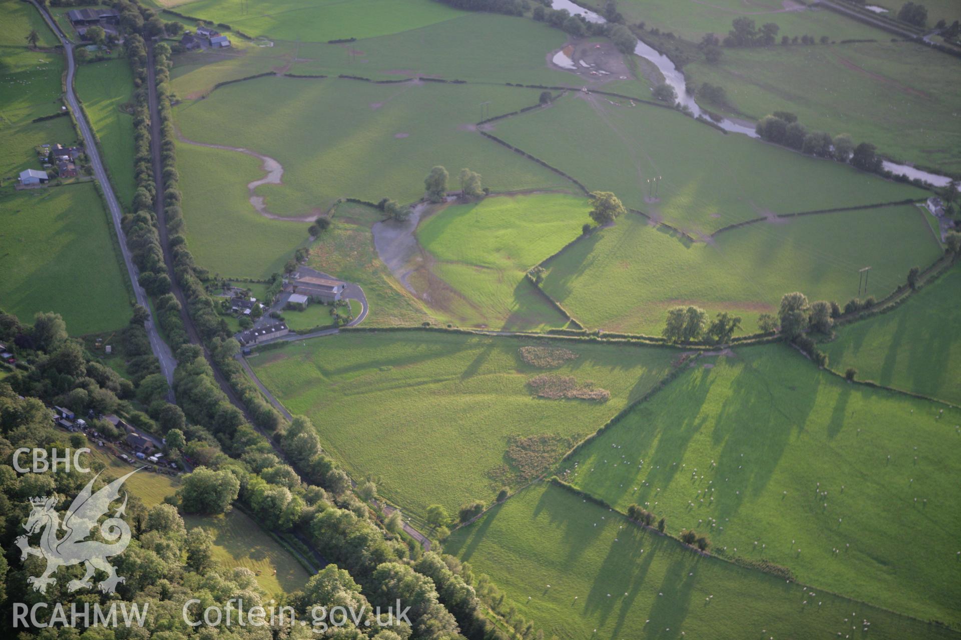 RCAHMW colour oblique aerial photograph of Lower Llegodig showing earthworks. Taken on 08 August 2007 by Toby Driver