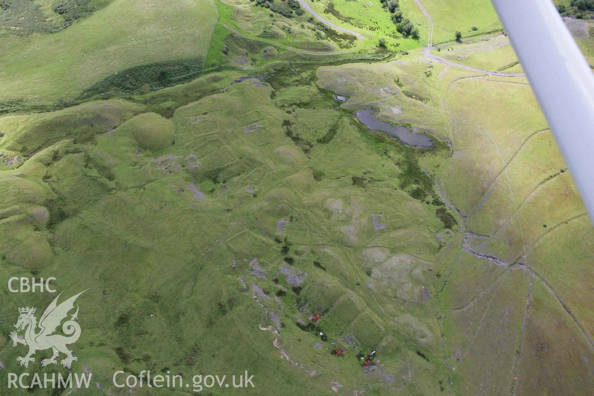 RCAHMW colour oblique aerial photograph of the deserted Ffos y Fran Ironstone Workers Settlement. Taken on 30 July 2007 by Toby Driver