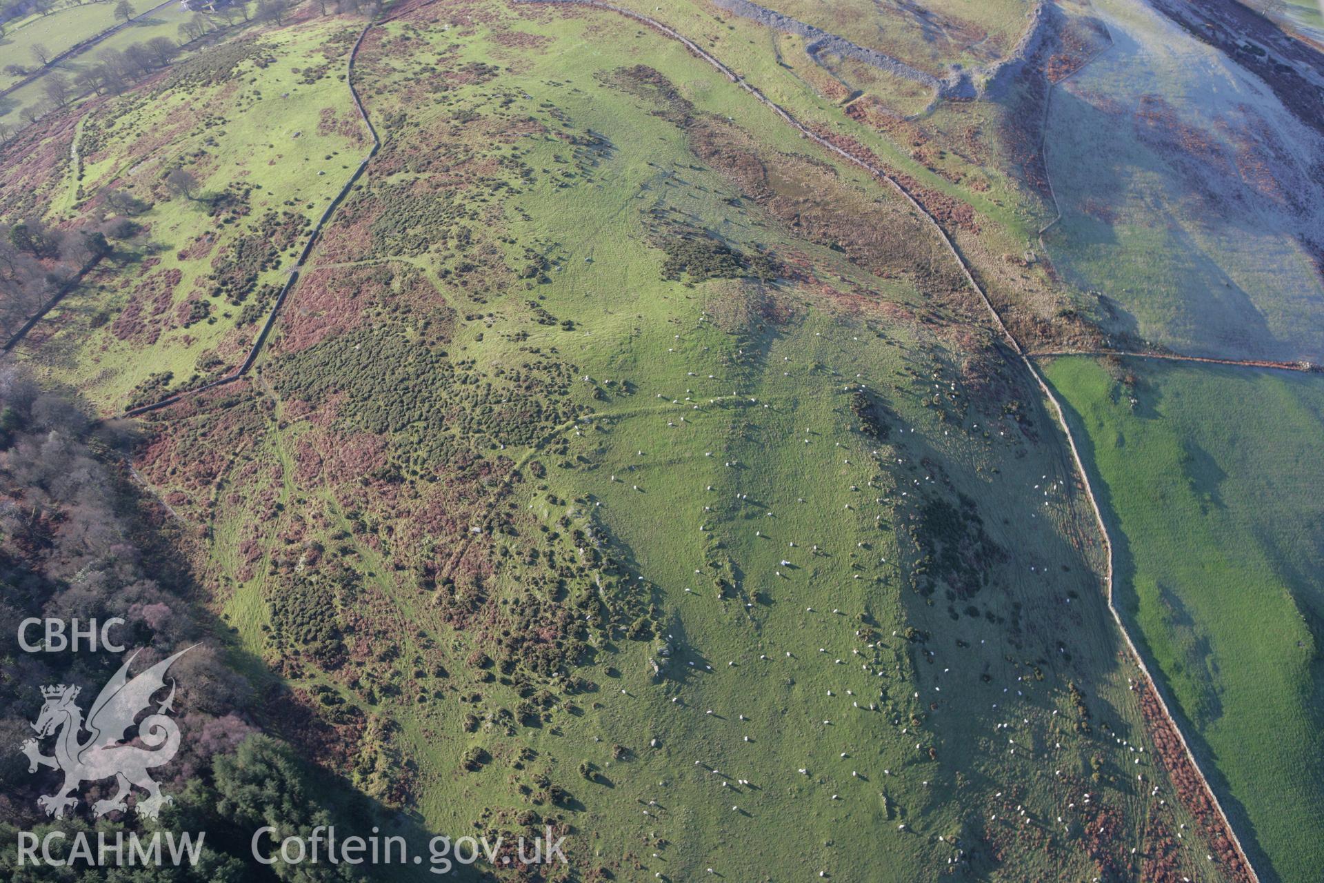 RCAHMW colour oblique photograph of Caer Drewyn, settlement and field system. Taken by Toby Driver on 11/12/2007.