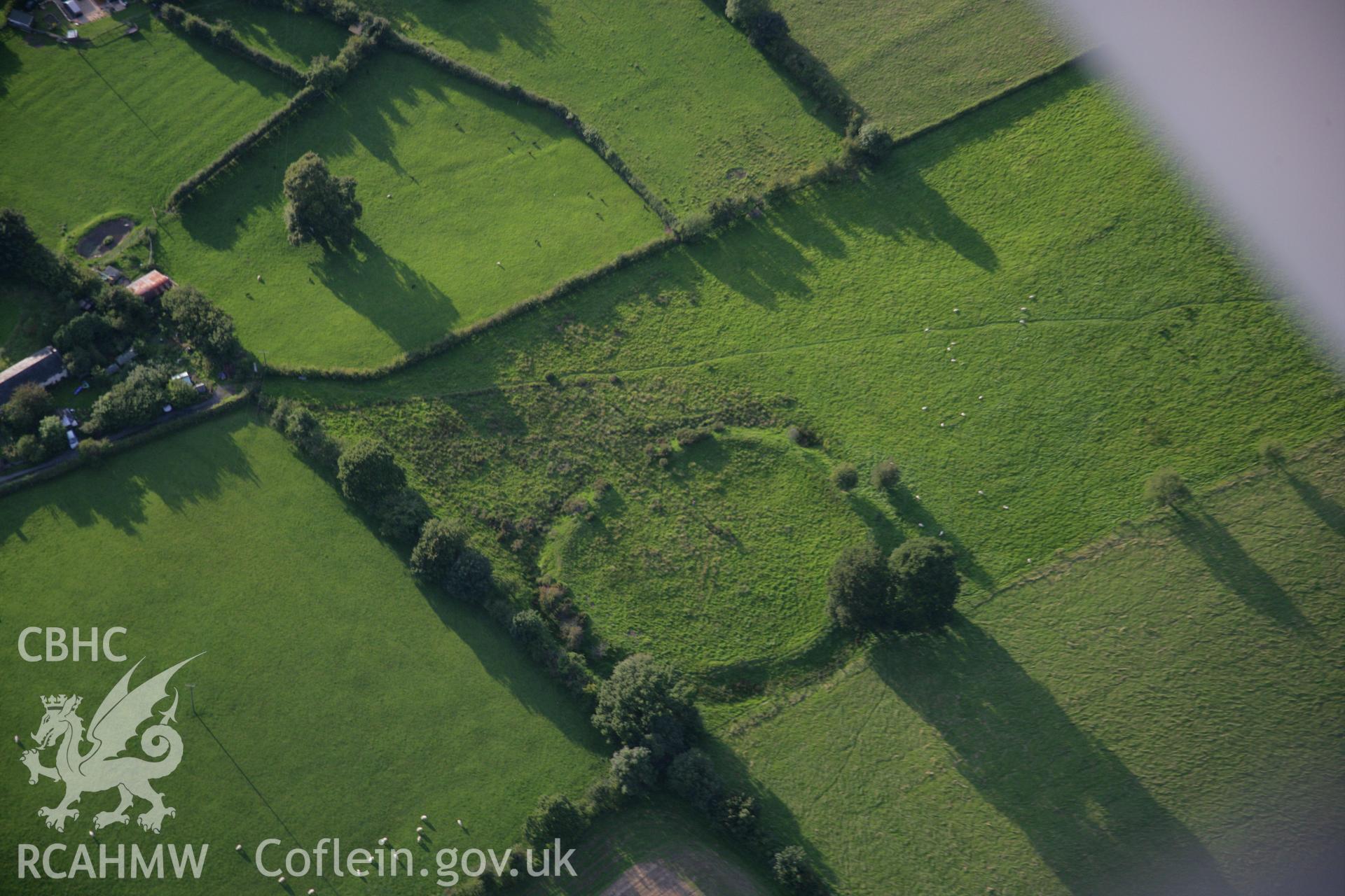 RCAHMW colour oblique aerial photograph of Caer Du Defended Enclosure. Taken on 08 August 2007 by Toby Driver