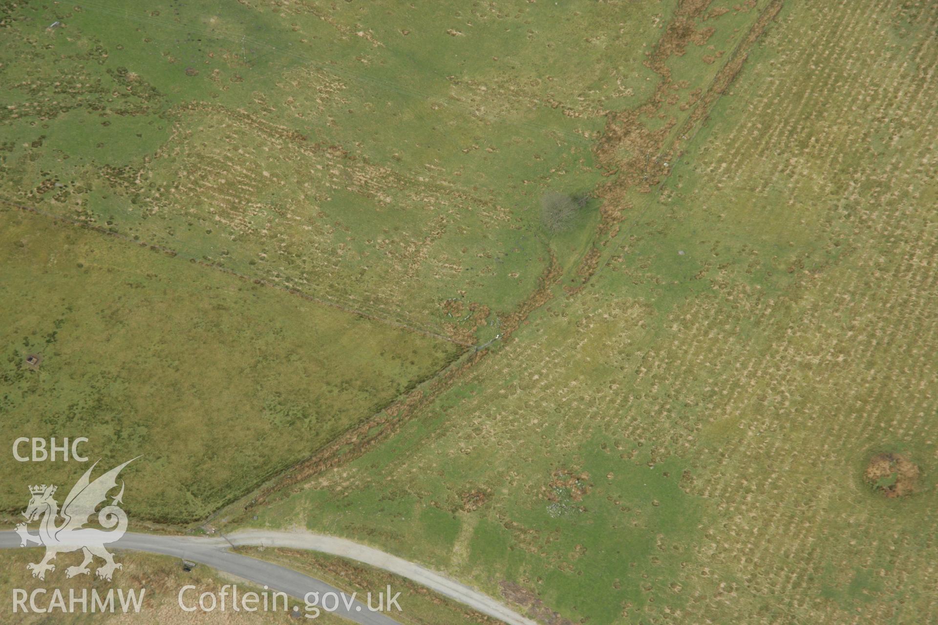 RCAHMW colour oblique aerial photograph of Hirnant Kerbed Cairn showing Stone Circle and Round Cairns Taken on 17 April 2007 by Toby Driver