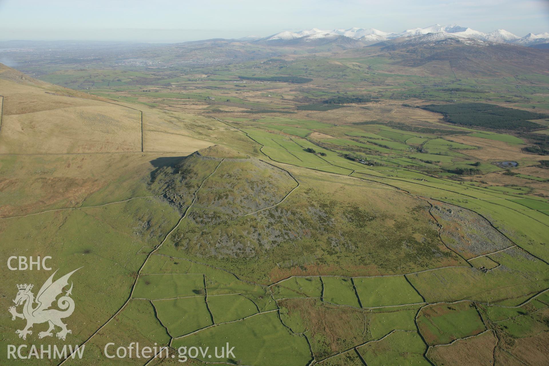 RCAHMW colour oblique aerial photograph of Pen-y-Gaer, with view of Camp. Taken on 25 January 2007 by Toby Driver