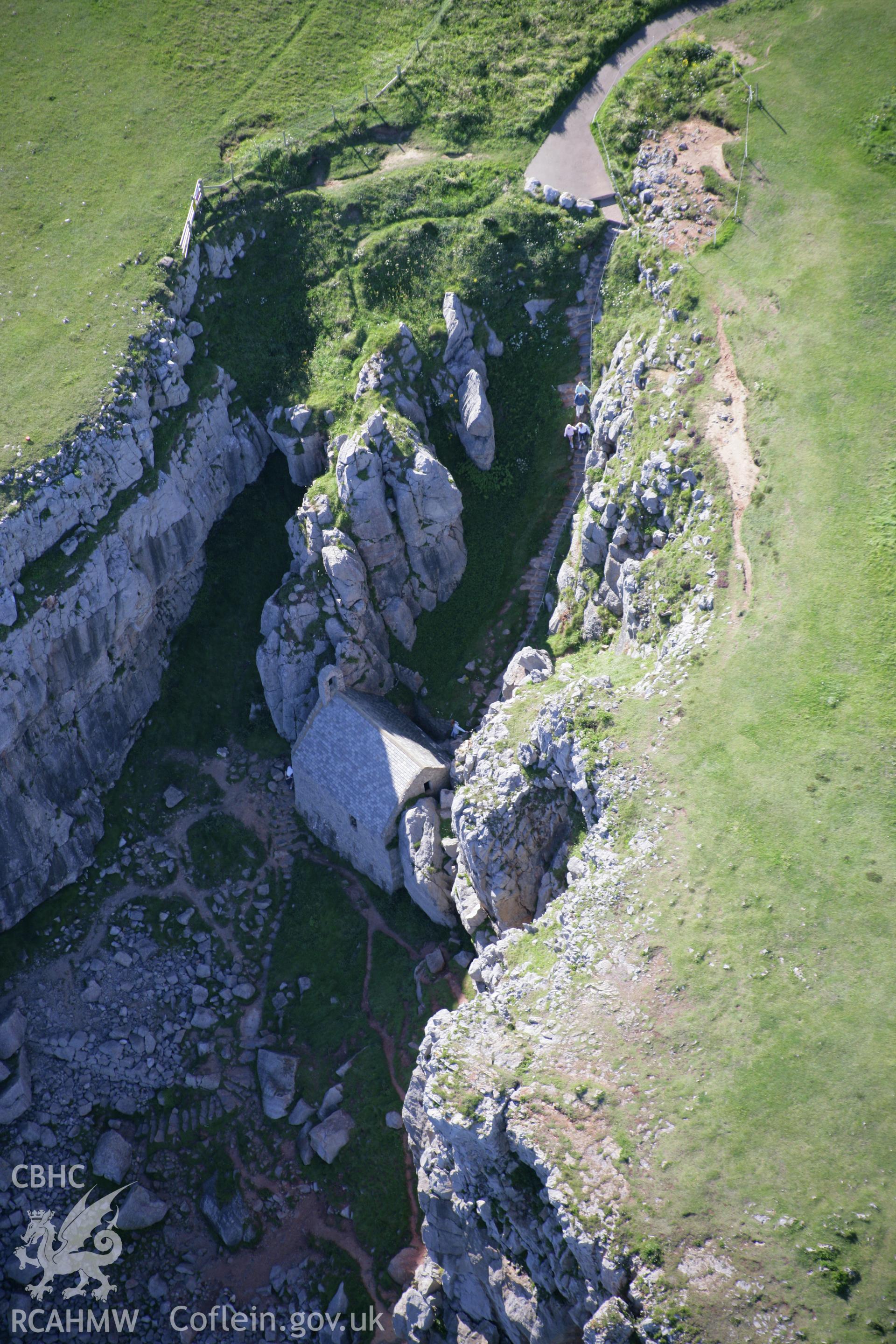 RCAHMW colour oblique aerial photograph of St Govan's Chapel. Taken on 30 July 2007 by Toby Driver