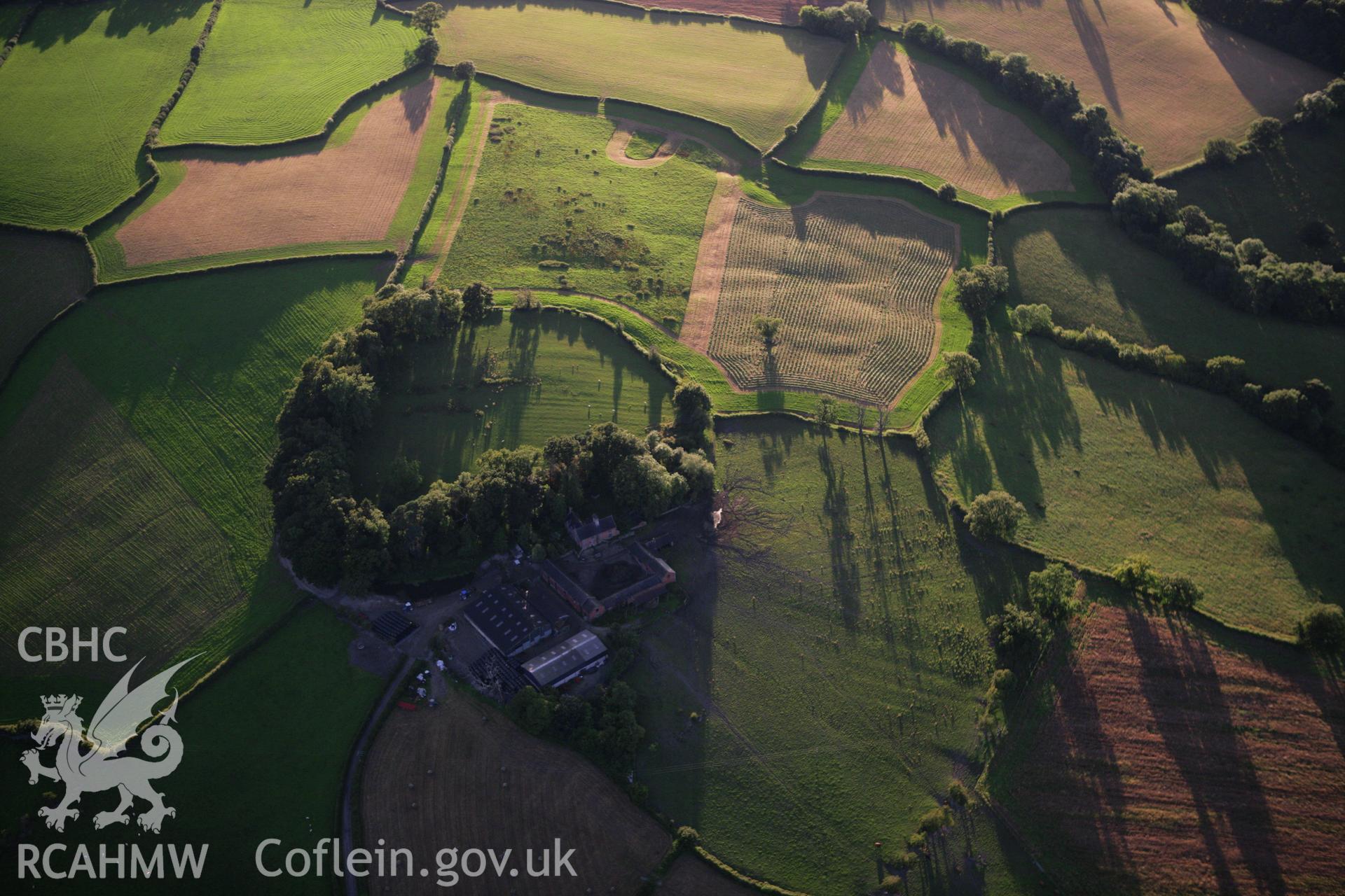 RCAHMW colour oblique aerial photograph of Great Cloddiau Enclosure. Taken on 08 August 2007 by Toby Driver