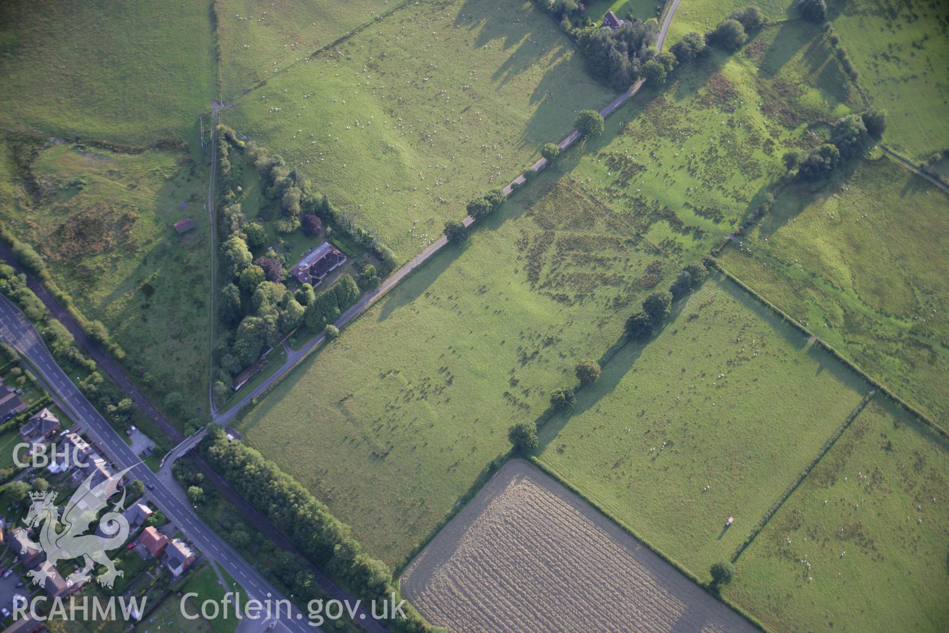 RCAHMW colour oblique aerial photograph of Llandrindod Common Roman Camp IX. Taken on 08 August 2007 by Toby Driver