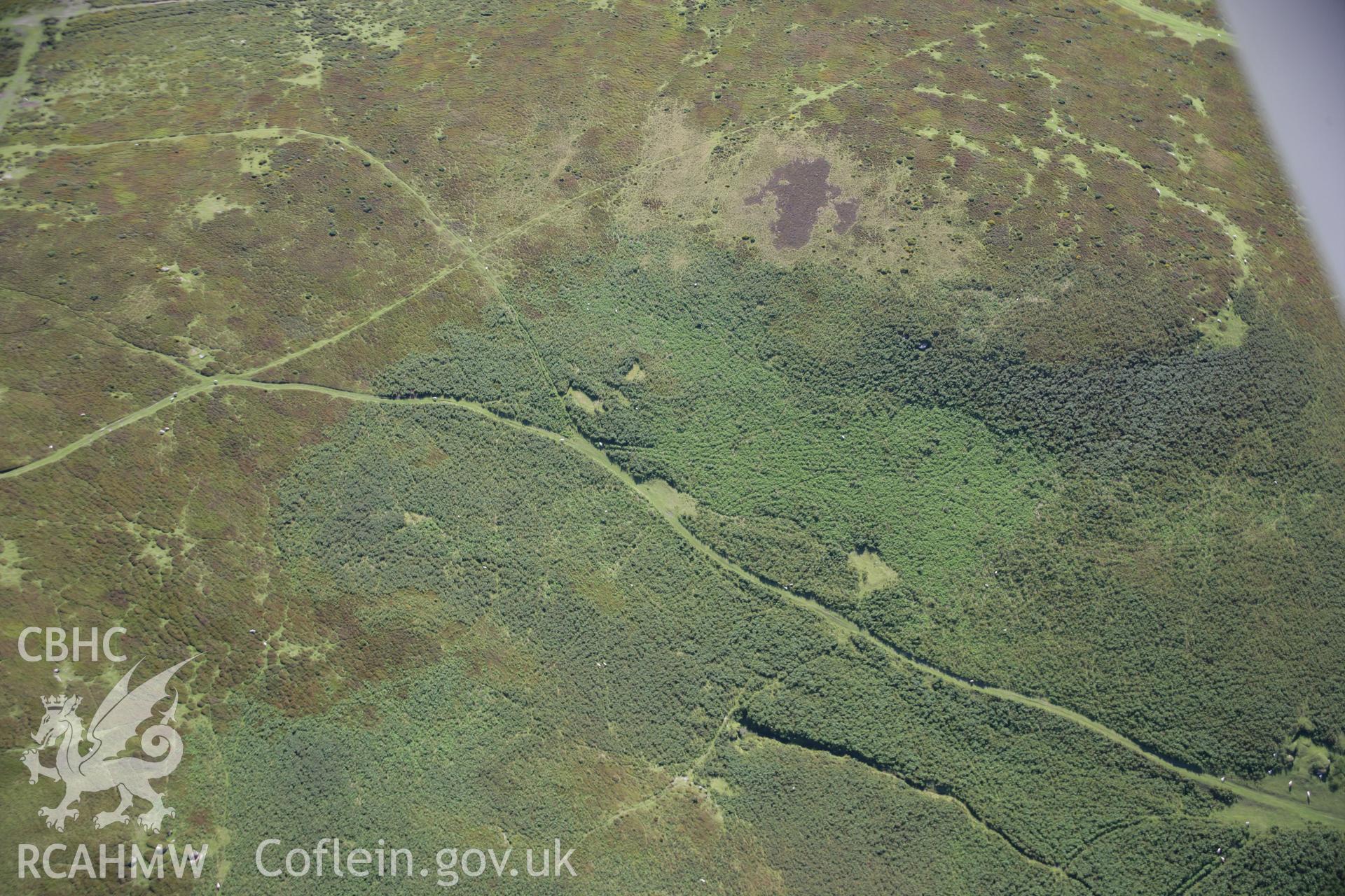 RCAHMW colour oblique aerial photograph of Cwmhindda Deserted Rural Settlement. Taken on 08 August 2007 by Toby Driver