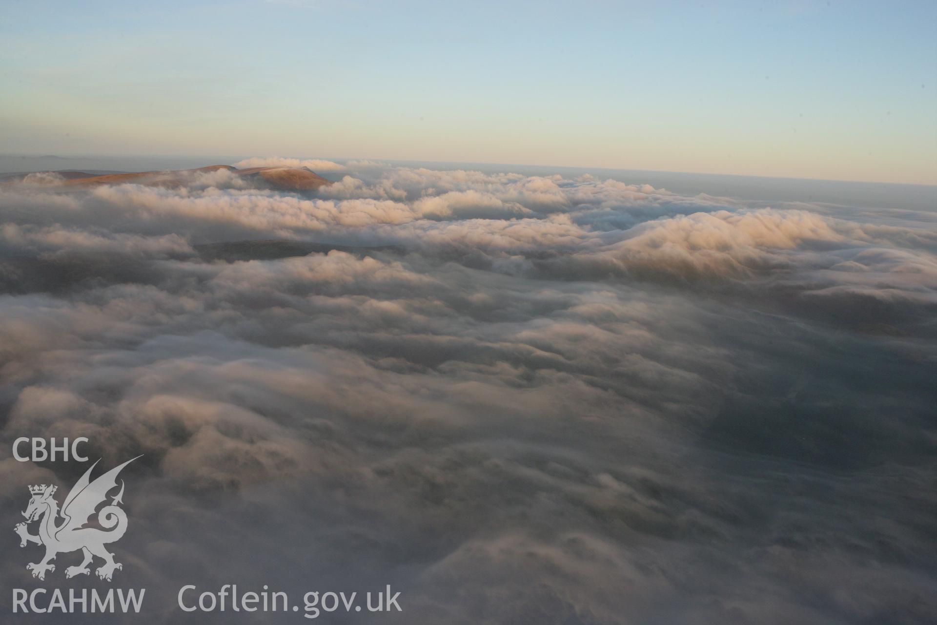 RCAHMW colour oblique photograph of Berwyn summit from the south, with cloud, in winter sunset. Taken by Toby Driver on 20/12/2007.