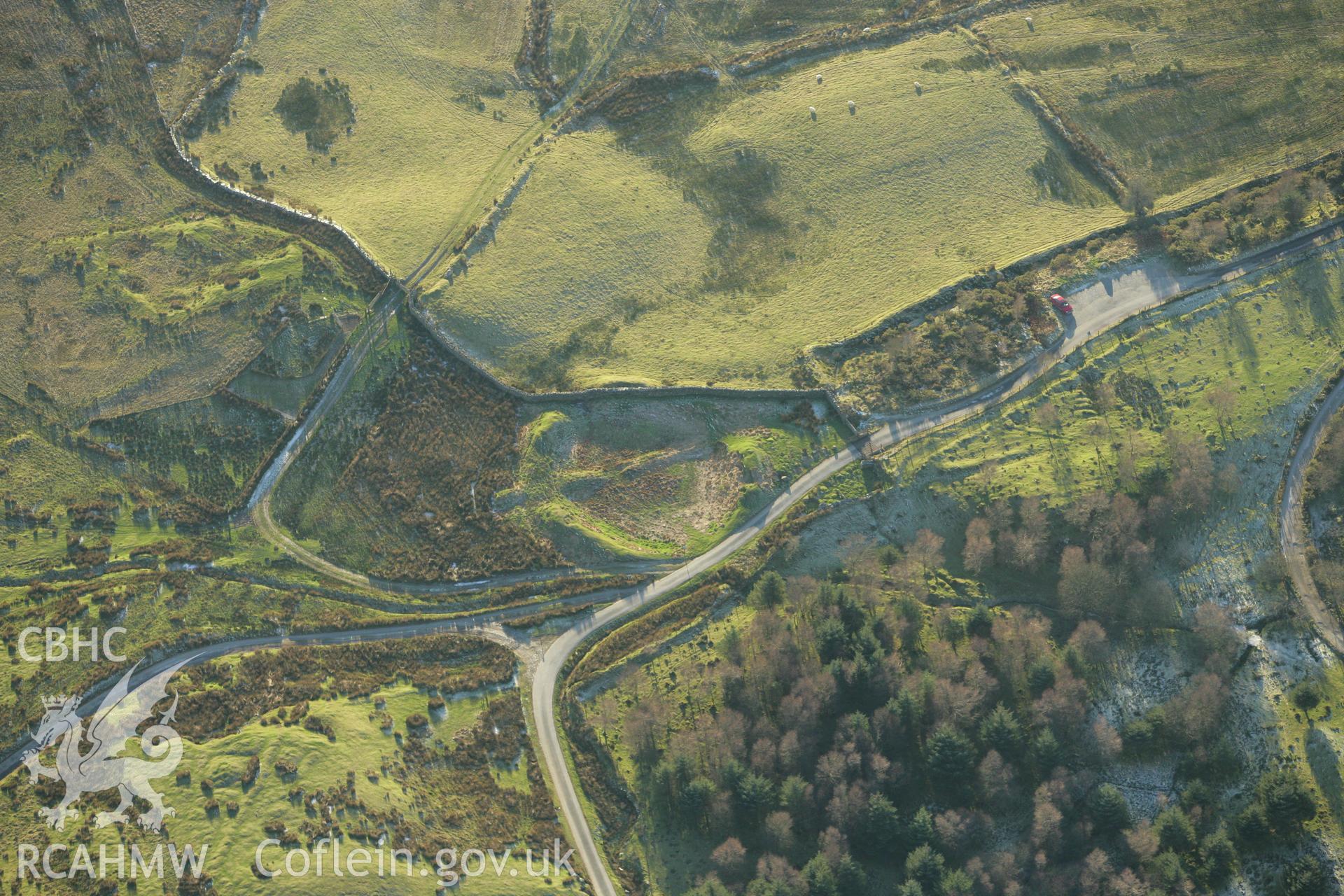 RCAHMW colour oblique photograph of Tomen y Mur Roman amphitheatre. Taken by Toby Driver on 20/12/2007.