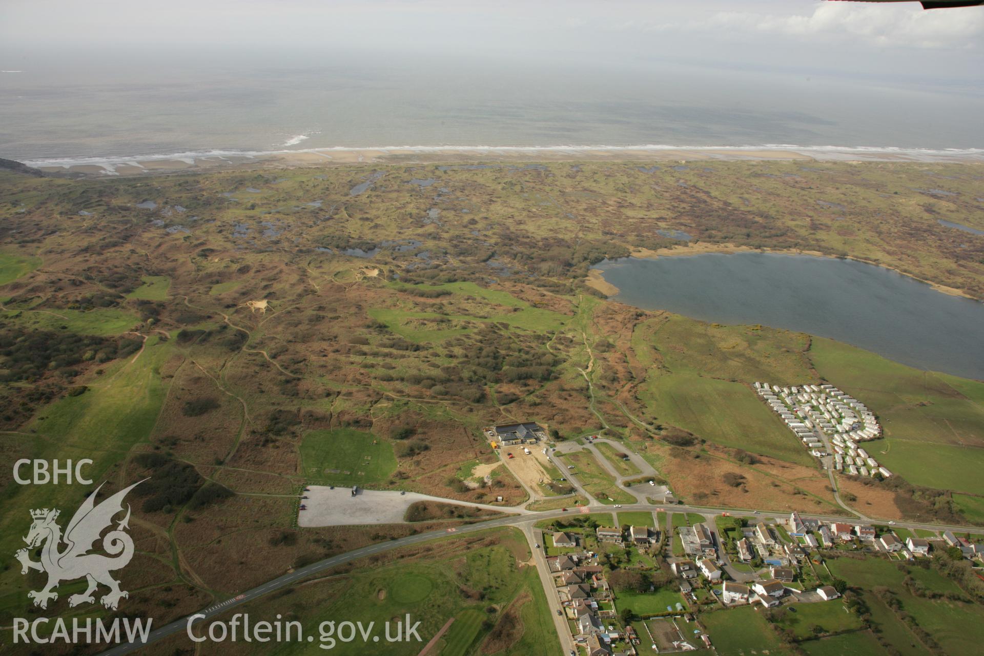 RCAHMW colour oblique aerial photograph of Kenfig House and village. Taken on 16 March 2007 by Toby Driver