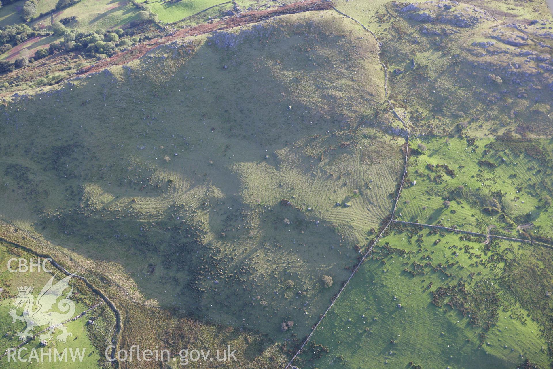 RCAHMW colour oblique aerial photograph of the remains of a settlement and traces of cultivation at Craig-y-Gesail. Taken on 06 September 2007 by Toby Driver