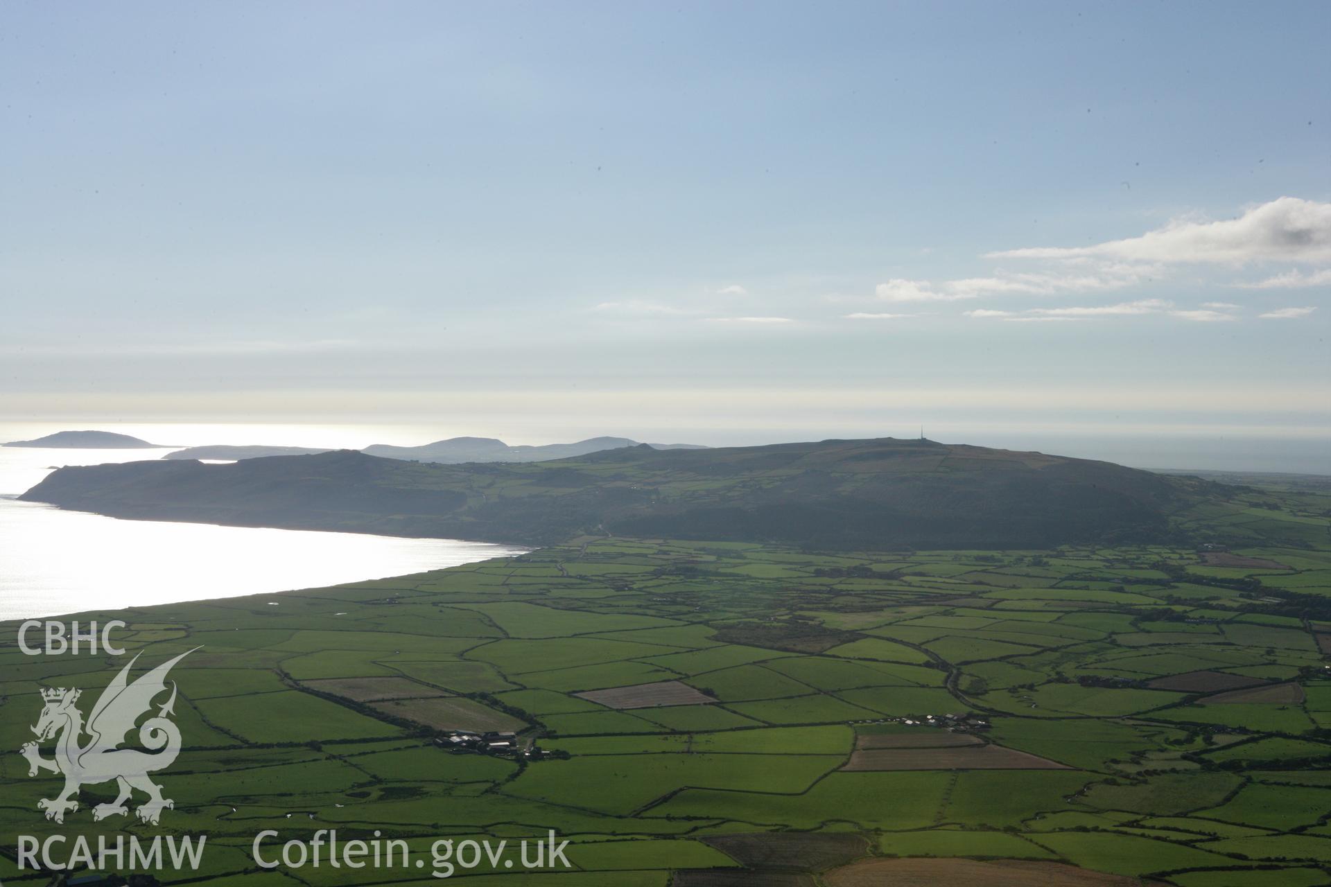 RCAHMW colour oblique aerial photograph showing landscape of Neolithic Axe Factory, Mynydd Rhiw, viewed from the east. Taken on 06 September 2007 by Toby Driver