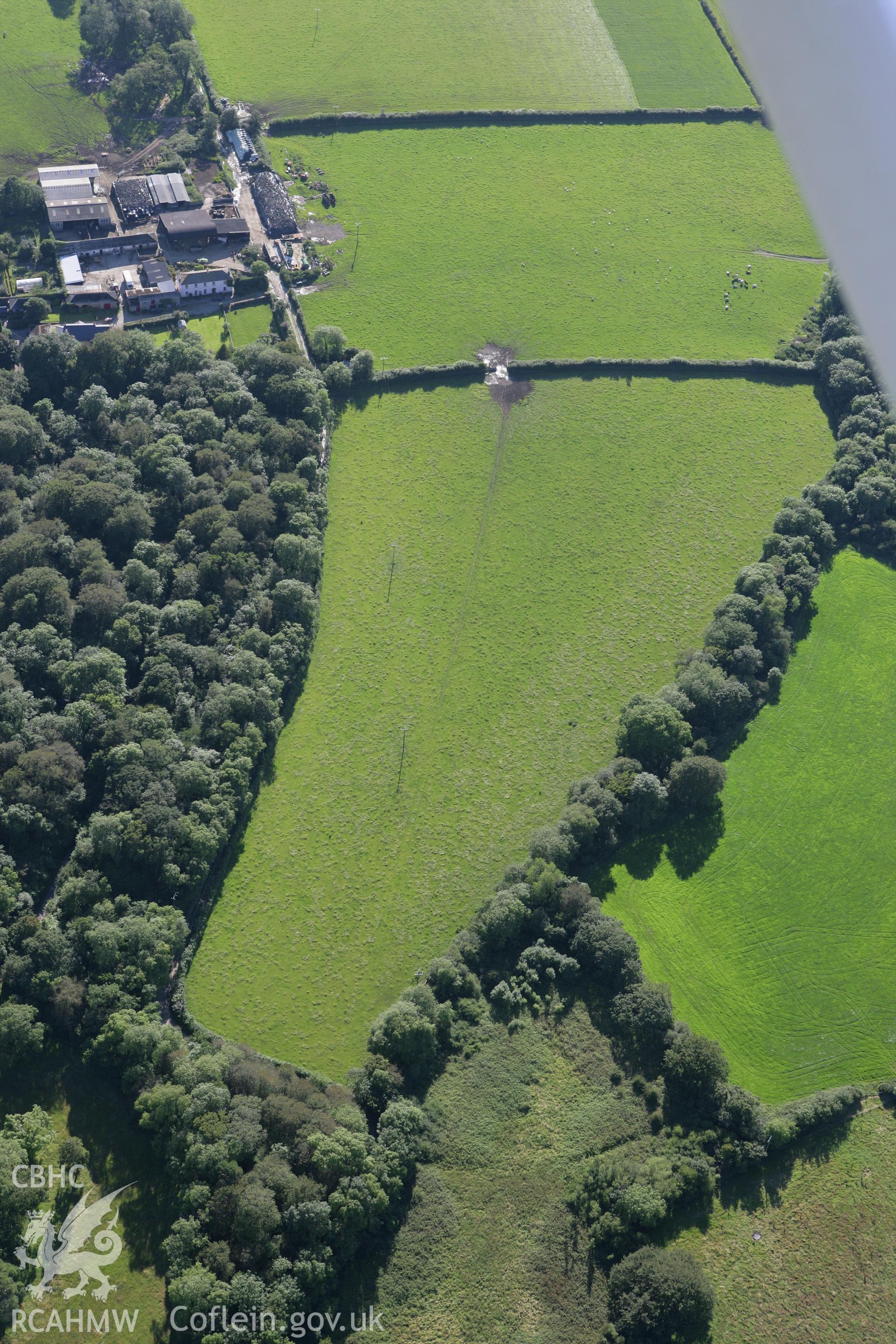 RCAHMW colour oblique aerial photograph of a pit circle 250m northeast of Cottesmore Farm. Taken on 30 July 2007 by Toby Driver